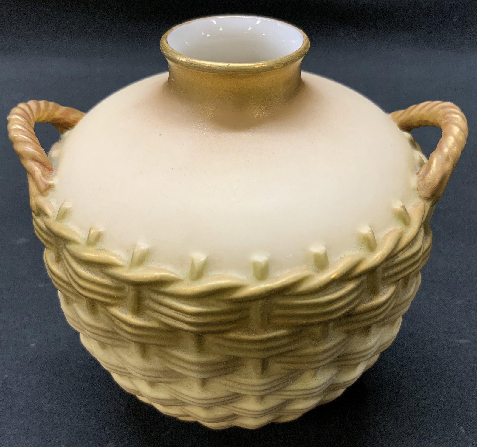 Antq Royal Worcester Blush Basketweave Vase, UK: Antique Royal Worcester Blush porcelain vase, molded basketweave body, twin braided rope style handles, fine gold gilt accents lining rim and base. Made in England. Underside marked with crown, regist