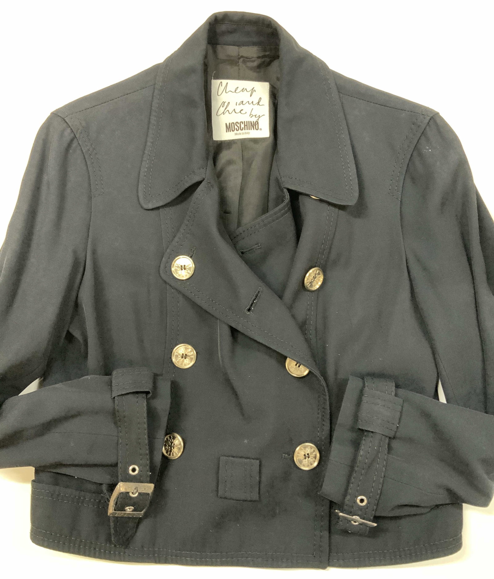 Vntg CHEAP AND CHIC cropped trench jacket Italy: Vintage CHEAP AND CHIC cropped trench jacket. Made of a black cotton rayon blend in Italy, size 10.CHEAP AND CHIC is a diffusion label under the Italian designer MOSCHINO. jacket features a double bre