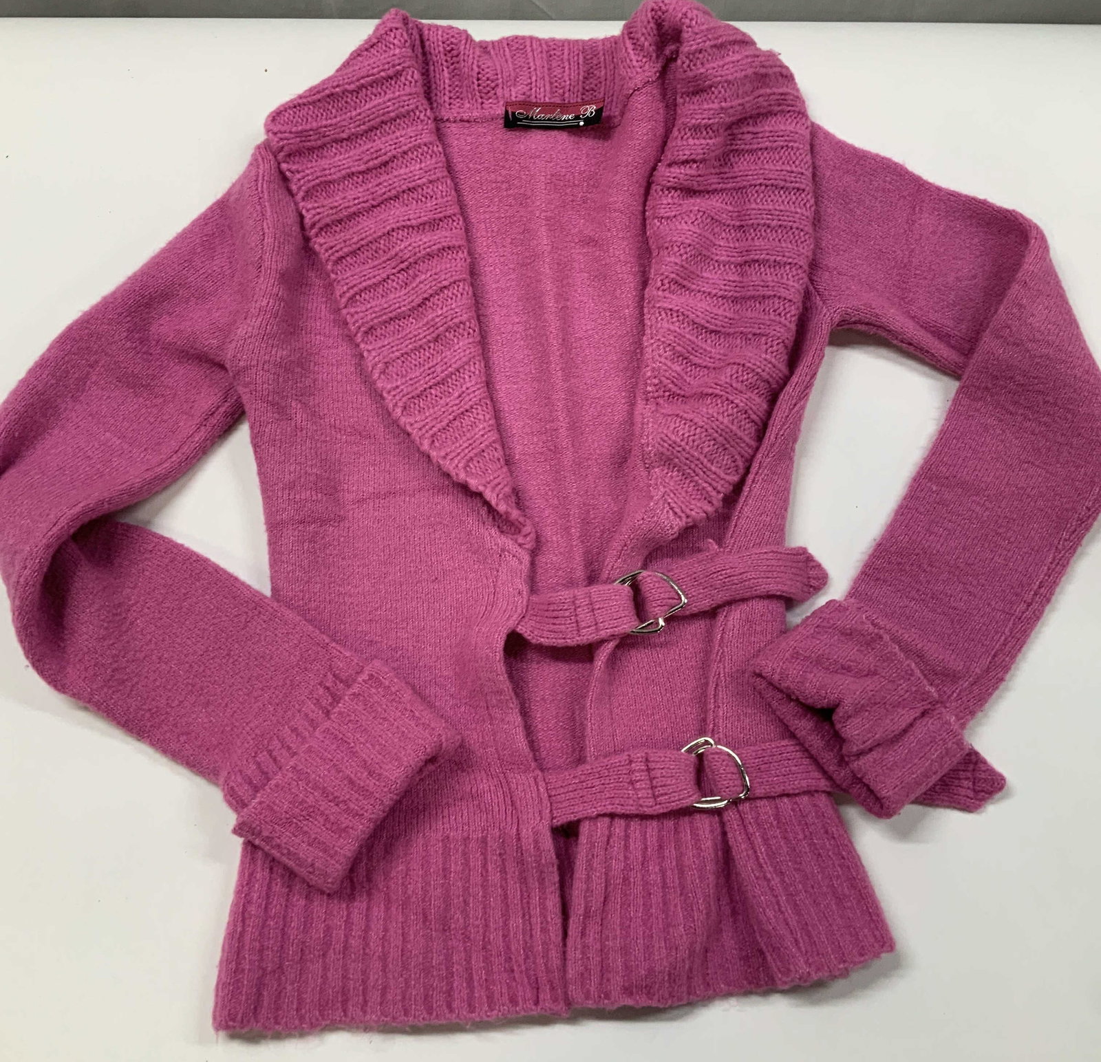 Vntg Marlene B double buckle cardigan, France: Vintage Marlene B double buckle cardigan. Designed and manufactured in France. Features a bold fuchsia pink color. A dramatic oversized ribbed shawl collar created a prominent frame around the necklin