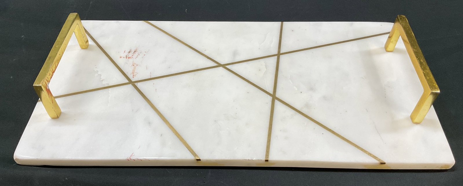 Surya Luxe Marble Decorative Tray: Surya Luxe marble decorative tray. Marked on underside. Piece has weight. Rectangular tray. White base with geometric gold toned inlay and matching handles. Measures approx 9 x 18 x 2.5 inches.