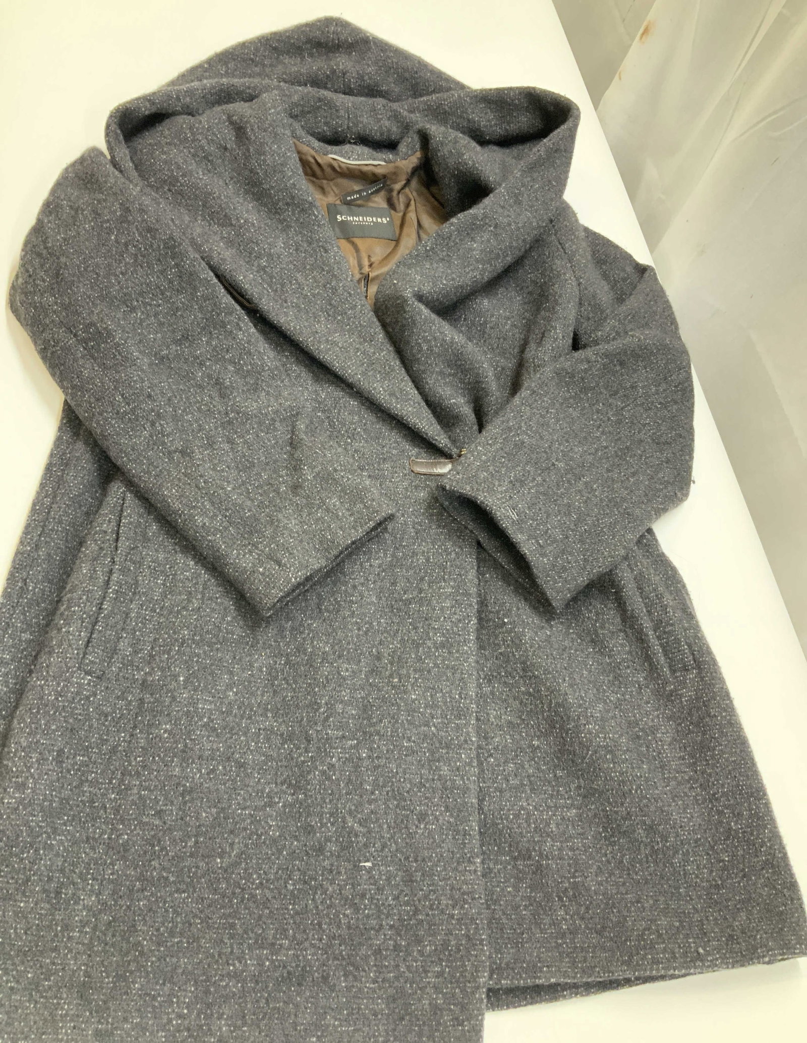 Vntg Schneiders Salzburg coat, Austria: Vintage Schneiders Salzburg coat. Made in Austria from a wool and angora blend fabric. Features a large hood that drapes down into the shawl collar. The front is secured with a single leather and meta