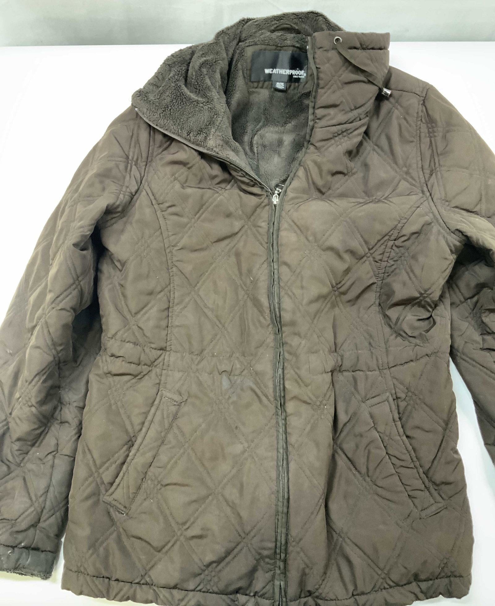 WEATHERPROOF since 1948 quilted outerwear jacket: WEATHERPROOF since 1948 quilted outerwear jacket. Size medium. Features timeless diamond quilted pattern in brown over a water resistant face fabric. Fully lined with thick faux fur teddy lining. Buil