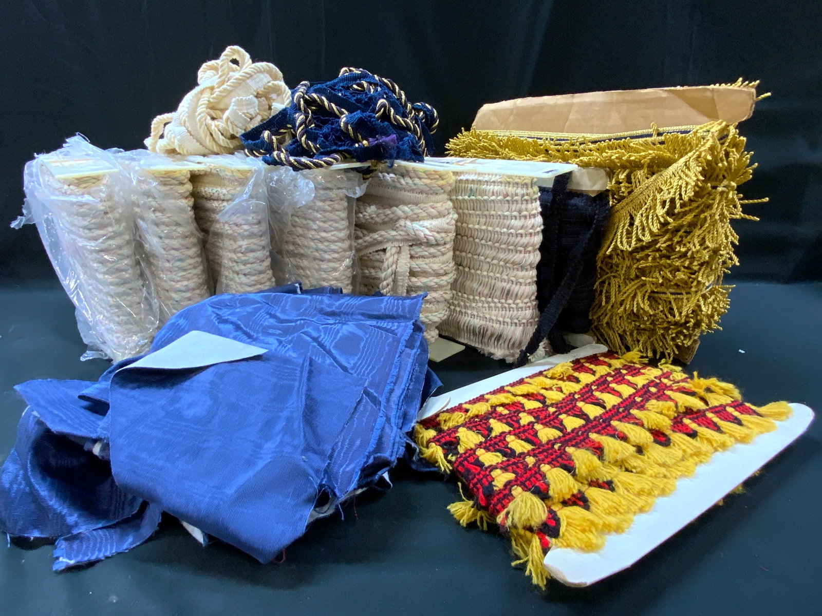 Vtg MxdLt12 Upholstery Trim & Scrap Fabric: Vintage mixed lot of approximately 12 pieces upholstery trim and scrap fabric + trim. Originally 18 Yards Per Roll. Not Unrolled, Measured, or Inspected. Part of a NYC Interior Designers Estate.