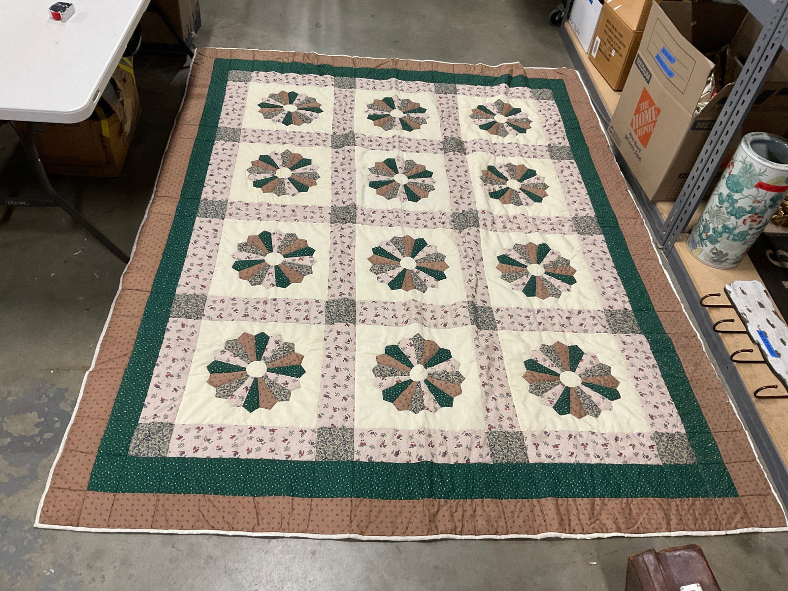 Dresden Plate Style Patchwork Quilt: Dresden Plate Style Patchwork Quilt. Fashioned after style popular in 1920s-1930s. Circular flower motifs made of contrasting patterned fabric. Pink, green, and brown tones. Some staining. Measures ap