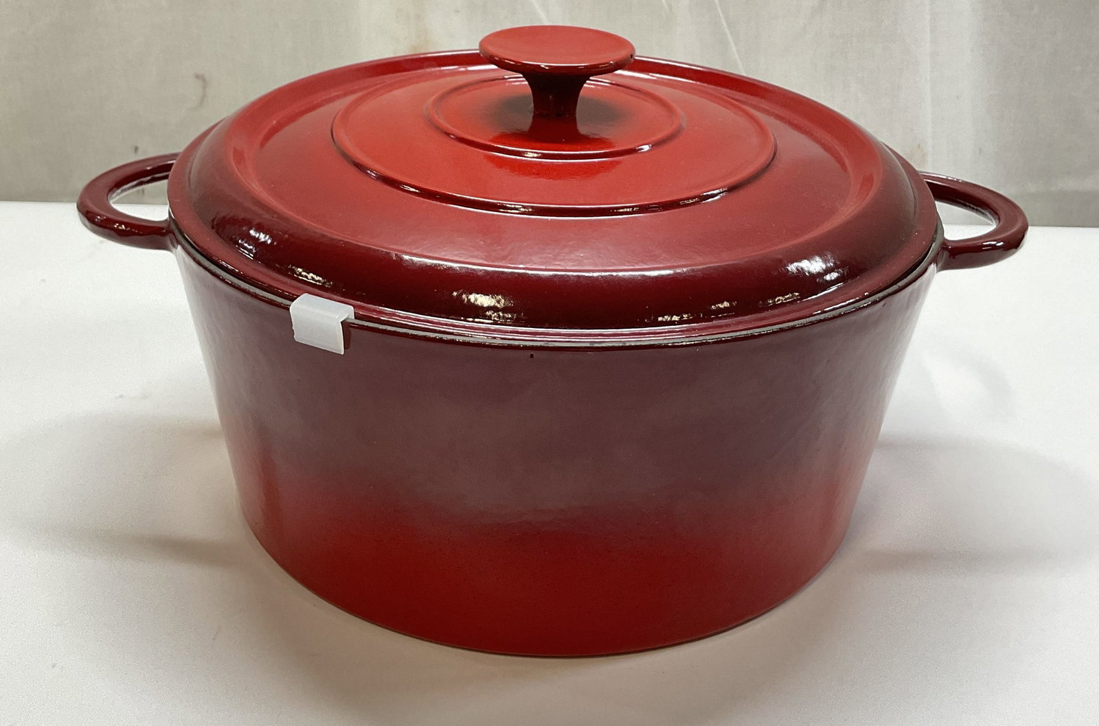 Vtg Red Enameled Cast Iron Dutch Oven France: Vintage red enameled cast iron Dutch oven. Marked made in France. Round pot with loop handles on either side. Lidded with round handle finial. Red gradient design. Measures ht approx 7 inches diam