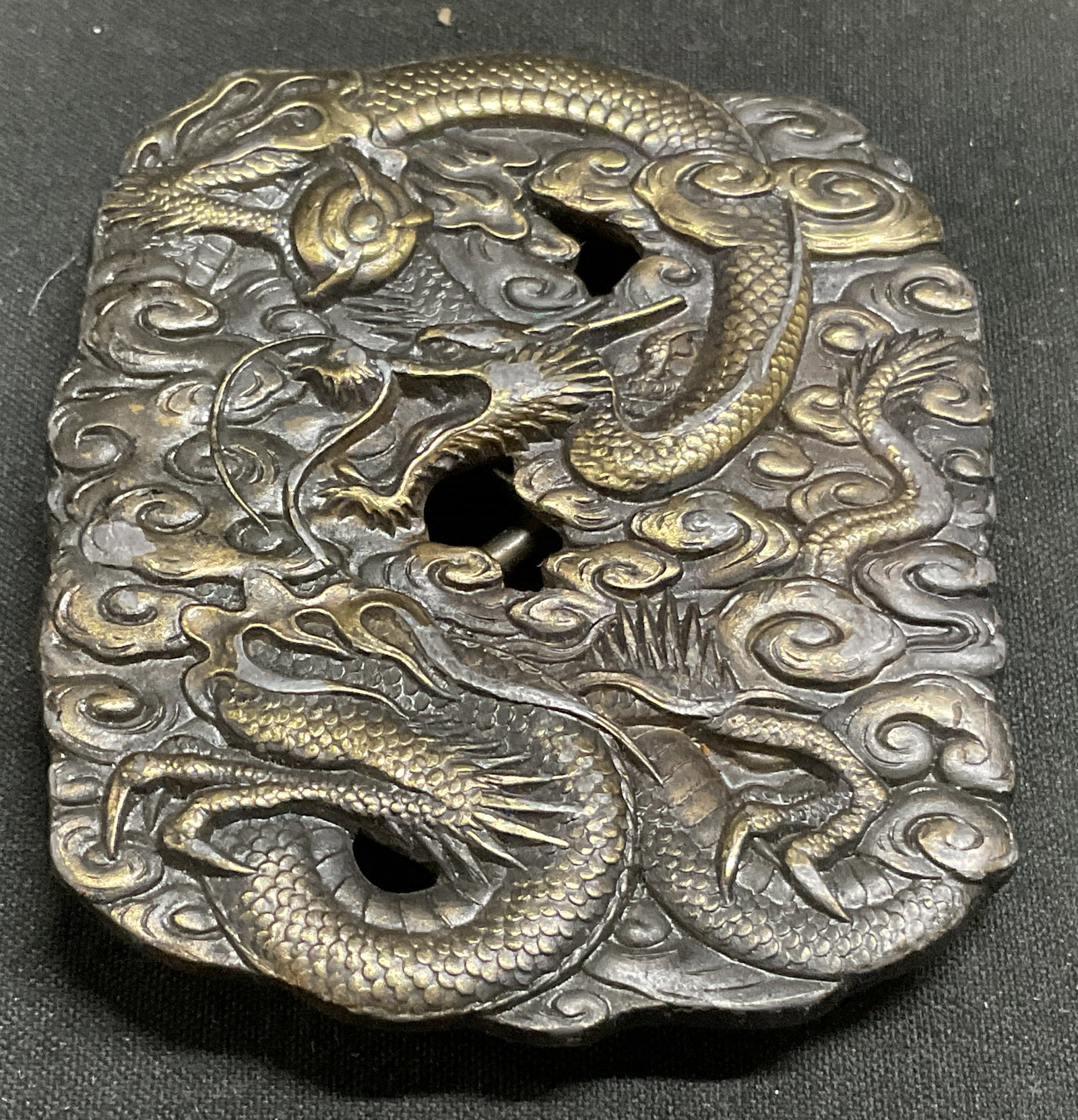 1974 Bergamot Brass Works Dragon Belt Buckle: 1974 Bergamot Brass Works Mythical Asian Dragon Belt Buckle. Brass-Plated pewter material. Open-Cut relief sculpture of traditional winding Eastern Dragon surrounded by cloud swirls. Plating loss and 