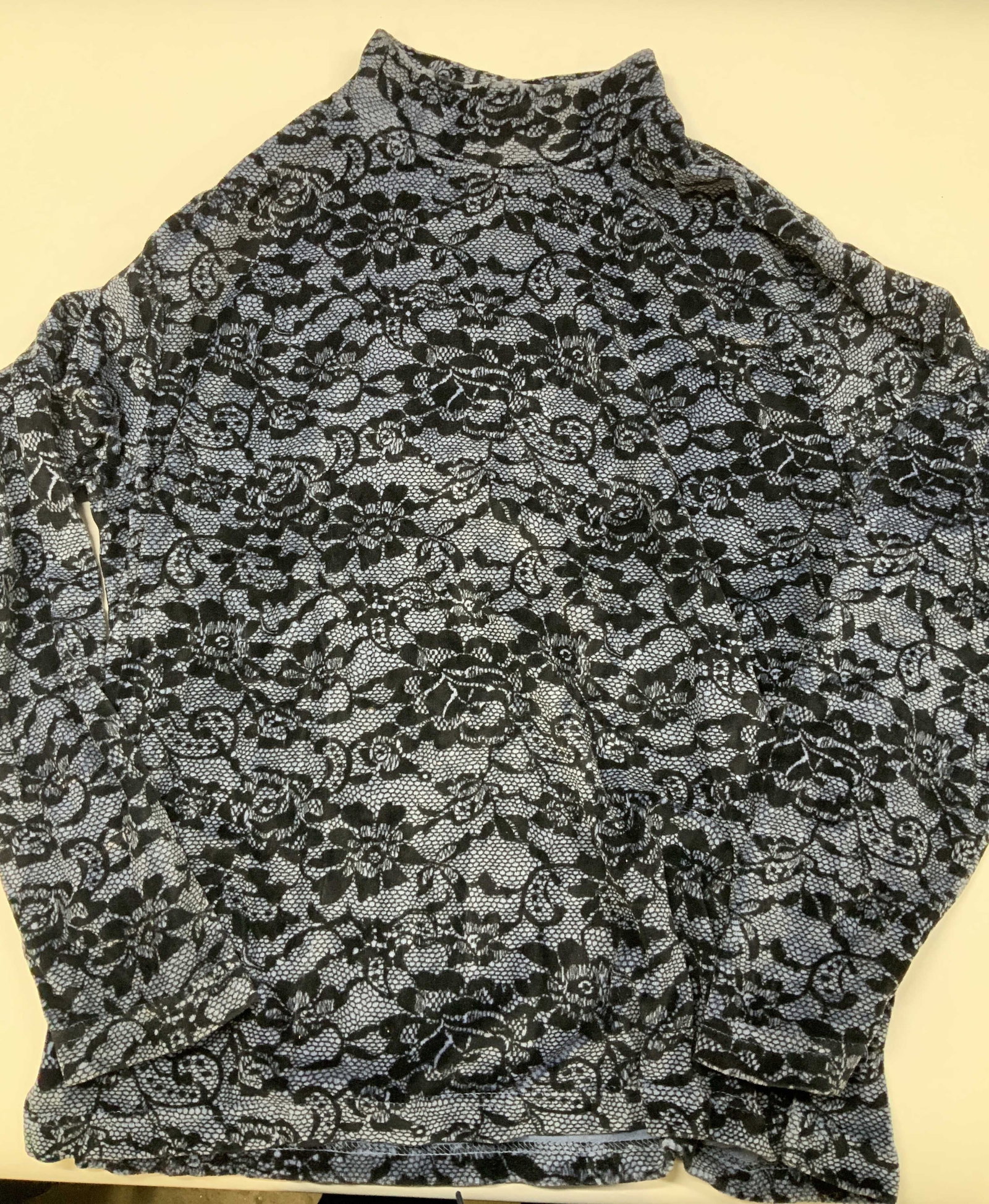 Vntg ERIKA velvet mock neck shirt, Russia: Vintage ERIKA velvet mock neck shirt. Made in Russia in size medium from a cotton polyester blend. Features an all over intricate black floral lace pattern over a light blue background. Designed with 