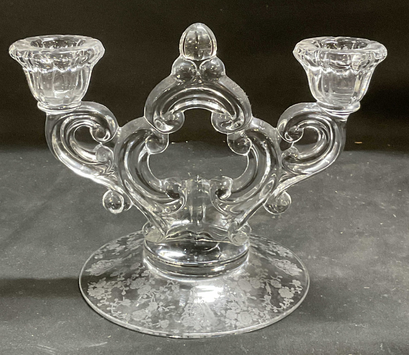 VTG Etched Glass Keyhole Stem Candelabra: Vintage Clear Glass Keyhole Stem Candelabra. Etched floral design base. Condition consistent with age and exposure. Measures approx 5.5in H x 8in L. vintage candelabra, glassware, keyhole stem, etched