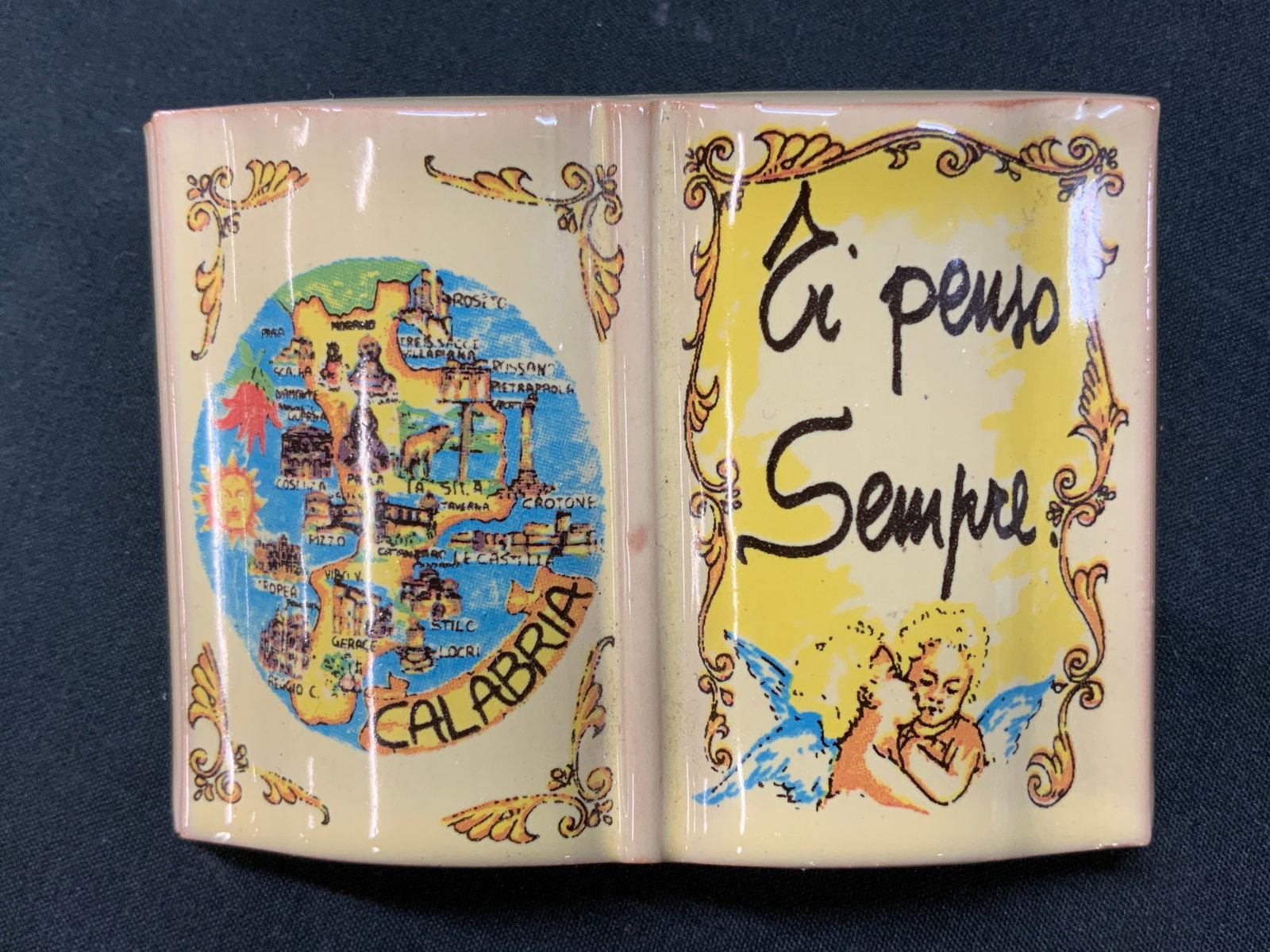 Vtg Calabria Souvenir Display Book, ITALY: Vintage Italian Souvenir Calabria Souvenir Display Book. Crafted from Italian Terracotta. Front face design tourist map of Calabria, Italy display plaque, alongside pair of cherub angels and Italian