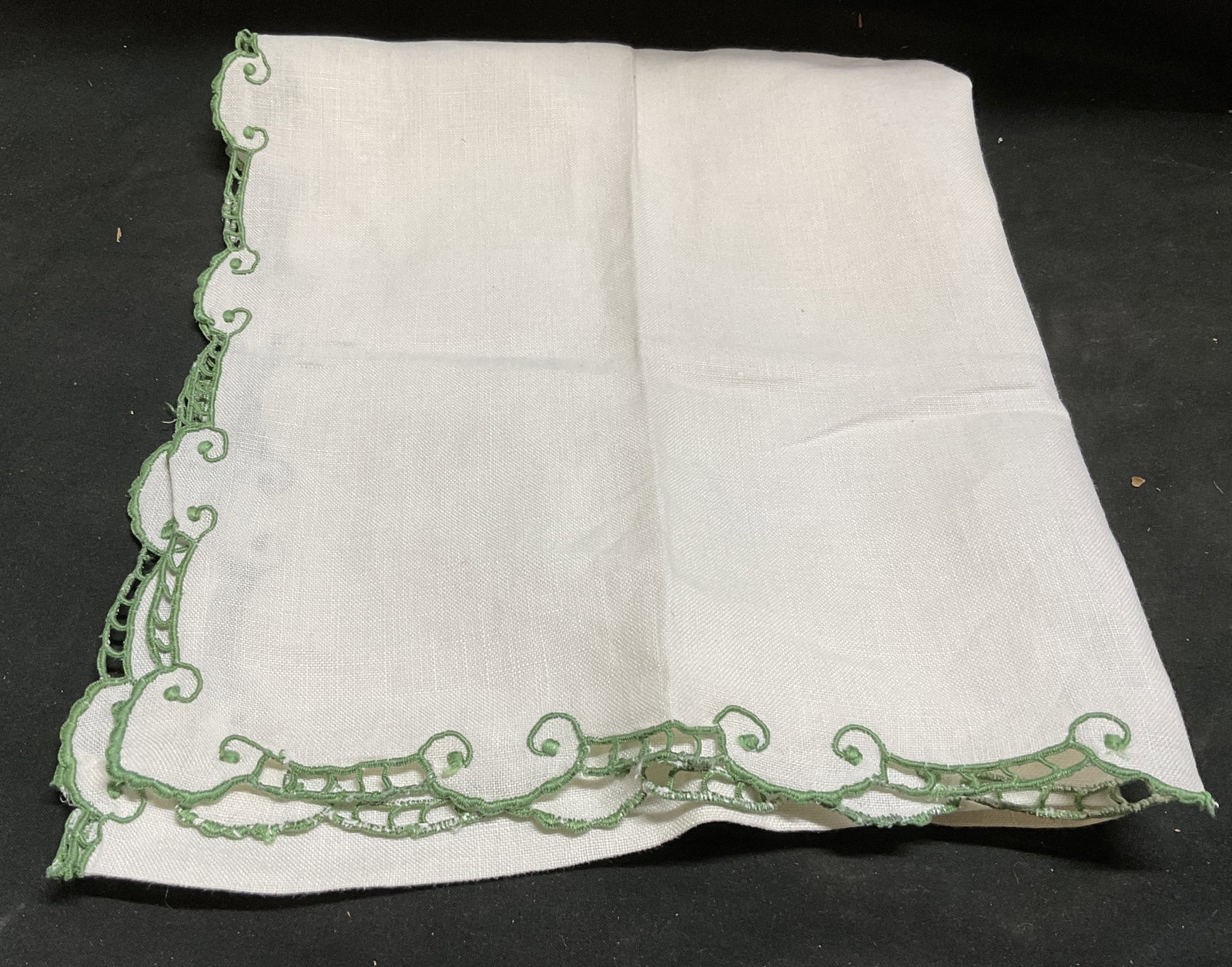 Vintage Embroidered Green Lace Table Linen: Vintage Beige and Green Lace Table Linen. Scalloped buttonhole stitch edges. Scrollwork motifs. Condition consistent with age and exposure. Measures approx 20in L x 17in W. vintage tea towels, linens,