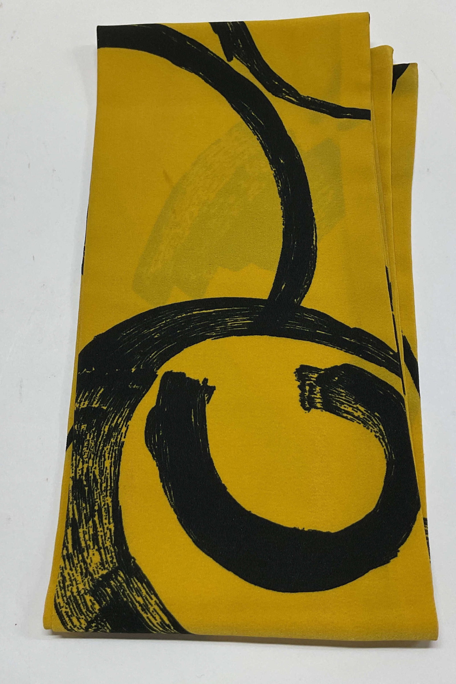 Vintage Black & Yellow Abstract Silk Scarf: Vintage black and yellow abstract silk scarf. Yellow background with black abstract motifs. Measures approx 5.5 x 43 inches. Wear consistent with exposure, blemishes. Silk scarf, scarf, wearables,