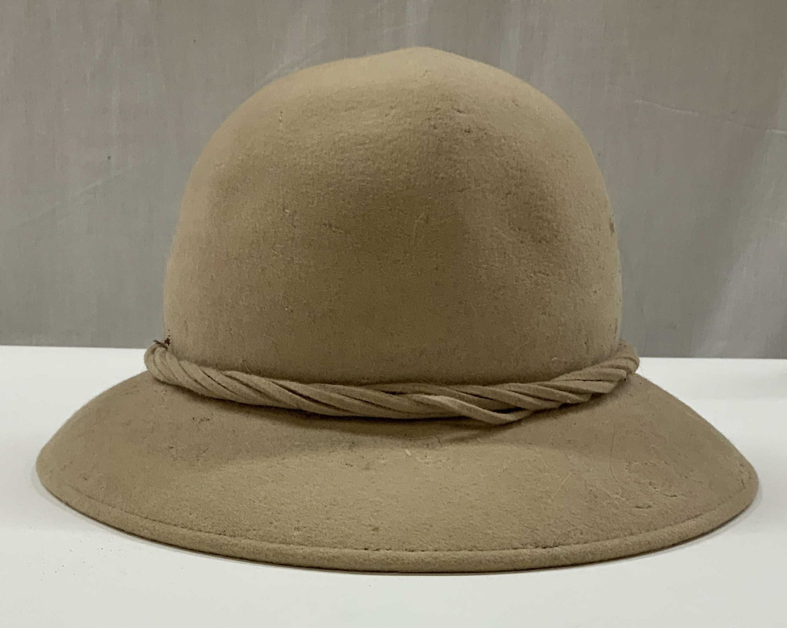 Vntg Frank Olive wool cloche hat, USA: Vintage Frank Olive cloche hat. Made of 100% wool in the USA. Hat features a thick texture rope style braided cord band, finished with a multi stranded tassel bow in the back. Frank Olives millinery