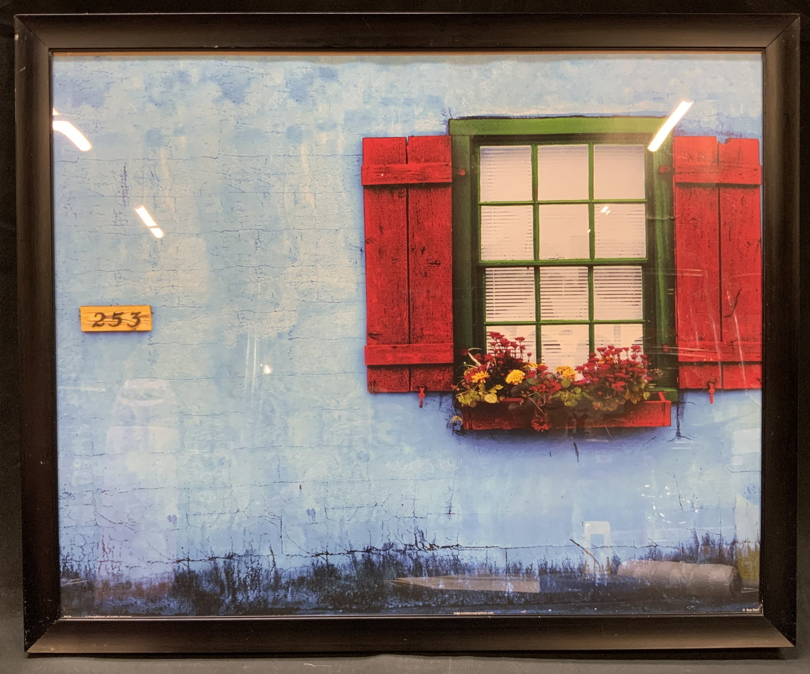 Vtg Frmd Ynon Mabat Window Photo Print: Vintage high contrast high saturation framed photograph print. Shot by Ynon Mabat. Published by SunDance Graphics. Bright red window shutter with flower box, against textured blue wall and house