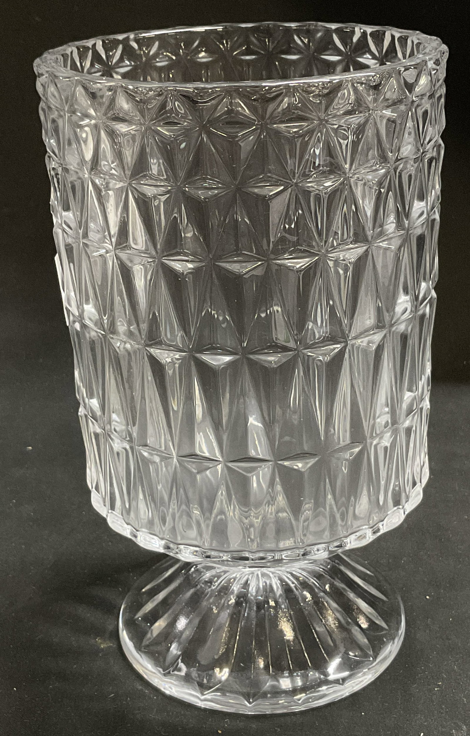 Geometric Patterned Crystal Pedestal Vase: Clear Crystal Pedestal Vase. Diamond-Shaped pattern along sides. Condition consistent with age and exposure. Measures approx 7in H x 4in Diam. clear crystal, glassware, pedestal, vases, table