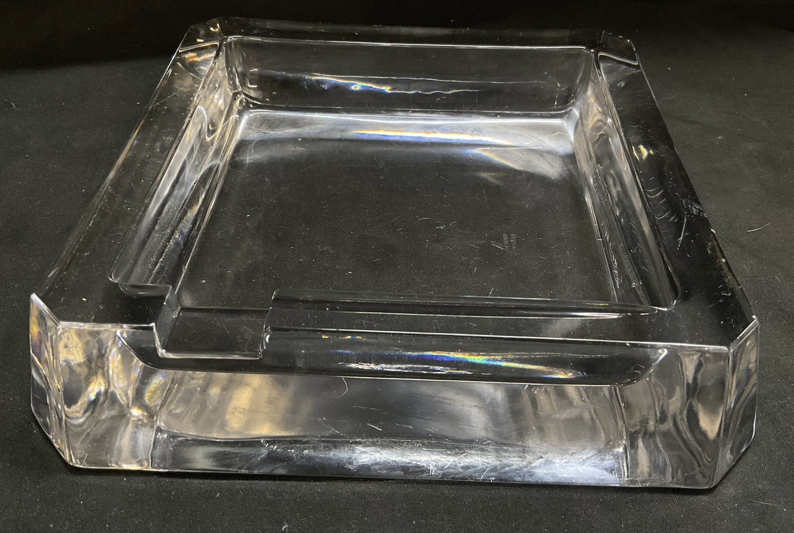 MCM Sgnd Arnolfo di Cambio Crystal Ashtray Italy: Mid-Century Modern Signed Arnolfo di Cambio Heavy Clear Crystal Ashtray. Italy. Has significant weight. Square block design. Beveled corners. Cigarette or cigar holder indent. Scratching and chips pre