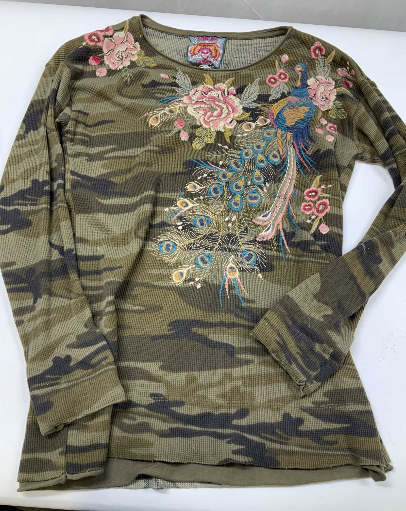 Johnny Was camo embroidered thermal shirt.: Johnny Was cameo embroidered thermal shirt. Made if 100% cotton in size small. The top contrasts rugged military inspired camouflage with delicate detailed bohemian embroidery. The signature elements 