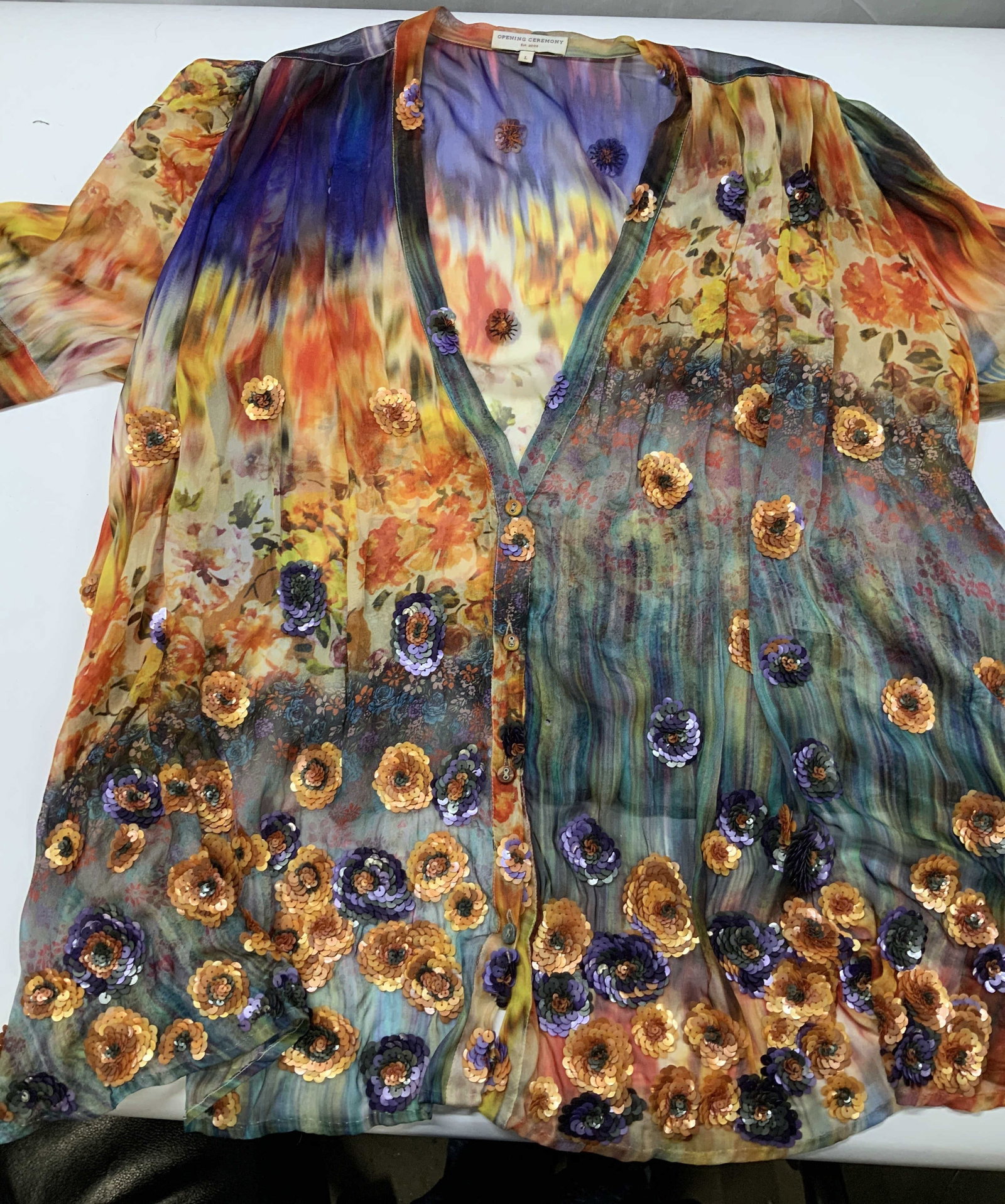 Open Ceremony silk sheer floral blouse.: Open Ceremony sheer floral blouse. Made if 100% silk in size large. Crafted entirely from a lightweight silk chiffon which gives it its signature semi sheer finish. It features a striking multi color 