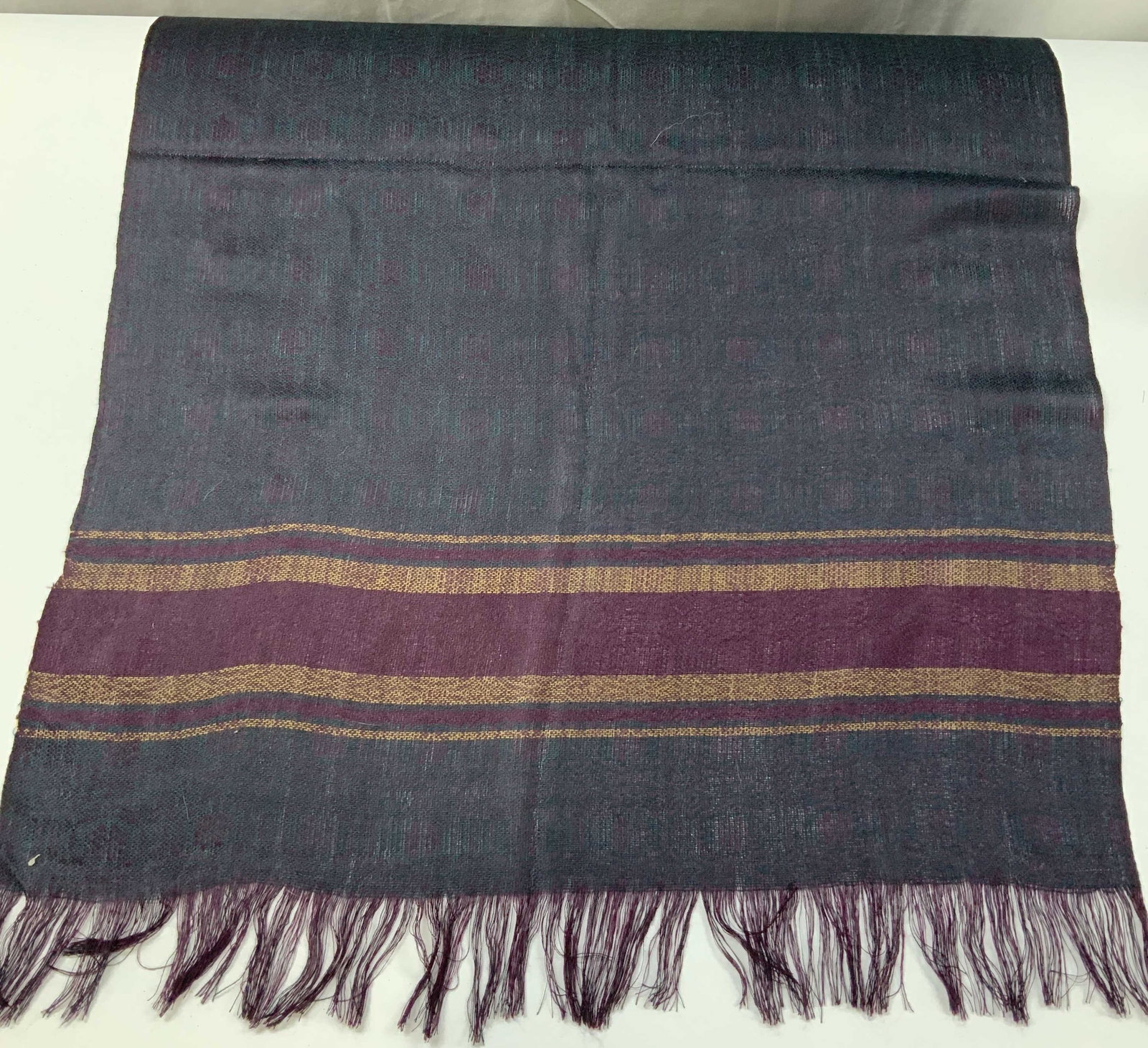 Vntg Artesanias TAHUANTINSUYO scarf, Ecuador: Vintage Artesanias TAHUANTINSUYO scarf. Handmade in Ecuador from 100% cotton. The main body features a subtle geometric pattern made up of a dark purple and green tone giving the illusion of texture. 
