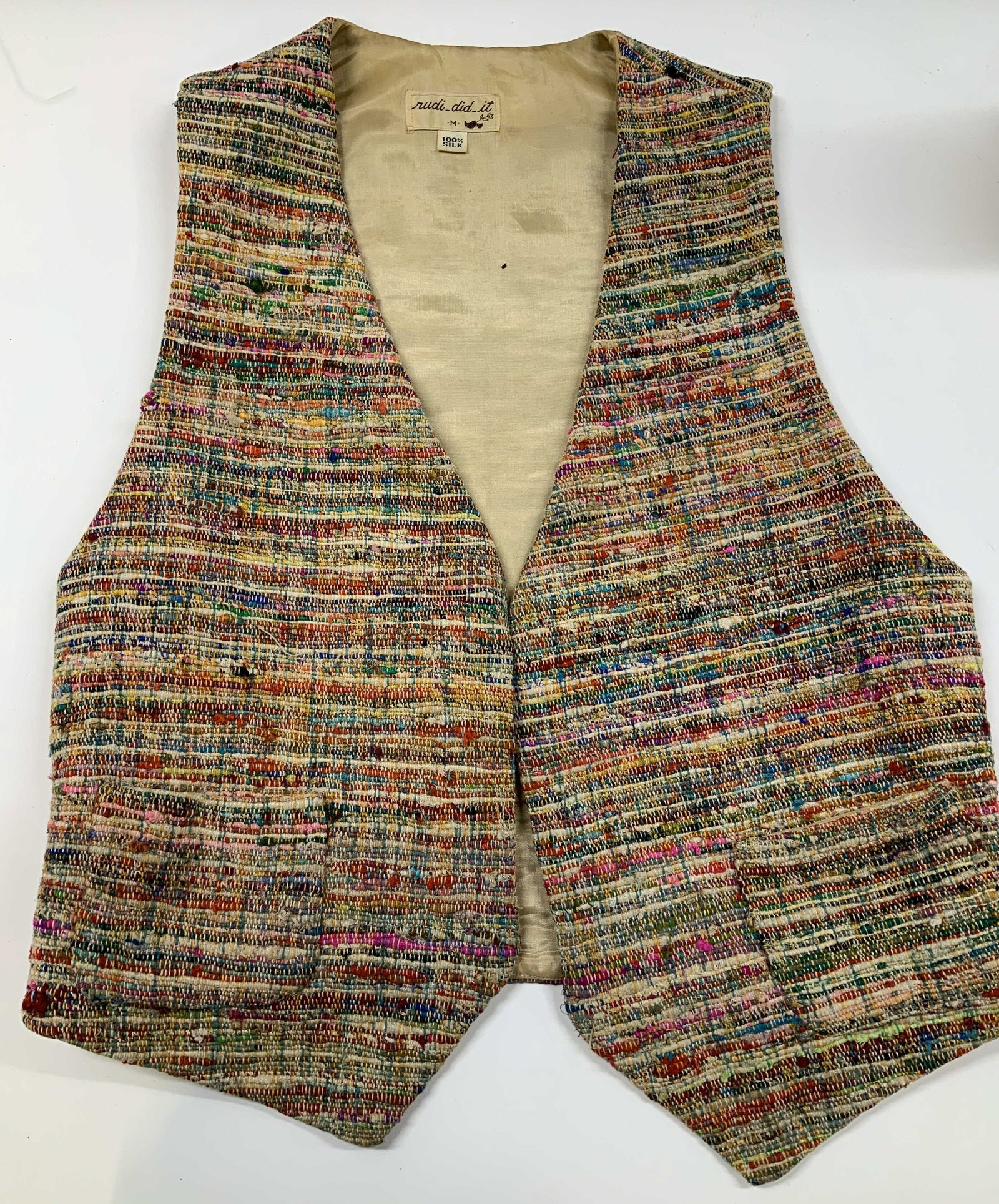 Vntg RUDI DID IT textured multicolored silk vest: Vintage RUDI DID IT textured multicolored vest. Made if 100% silk in size medium. It features a complex and colorful boucle style multi yarn weave. Designed with a classic v neck sleeveless silhouette