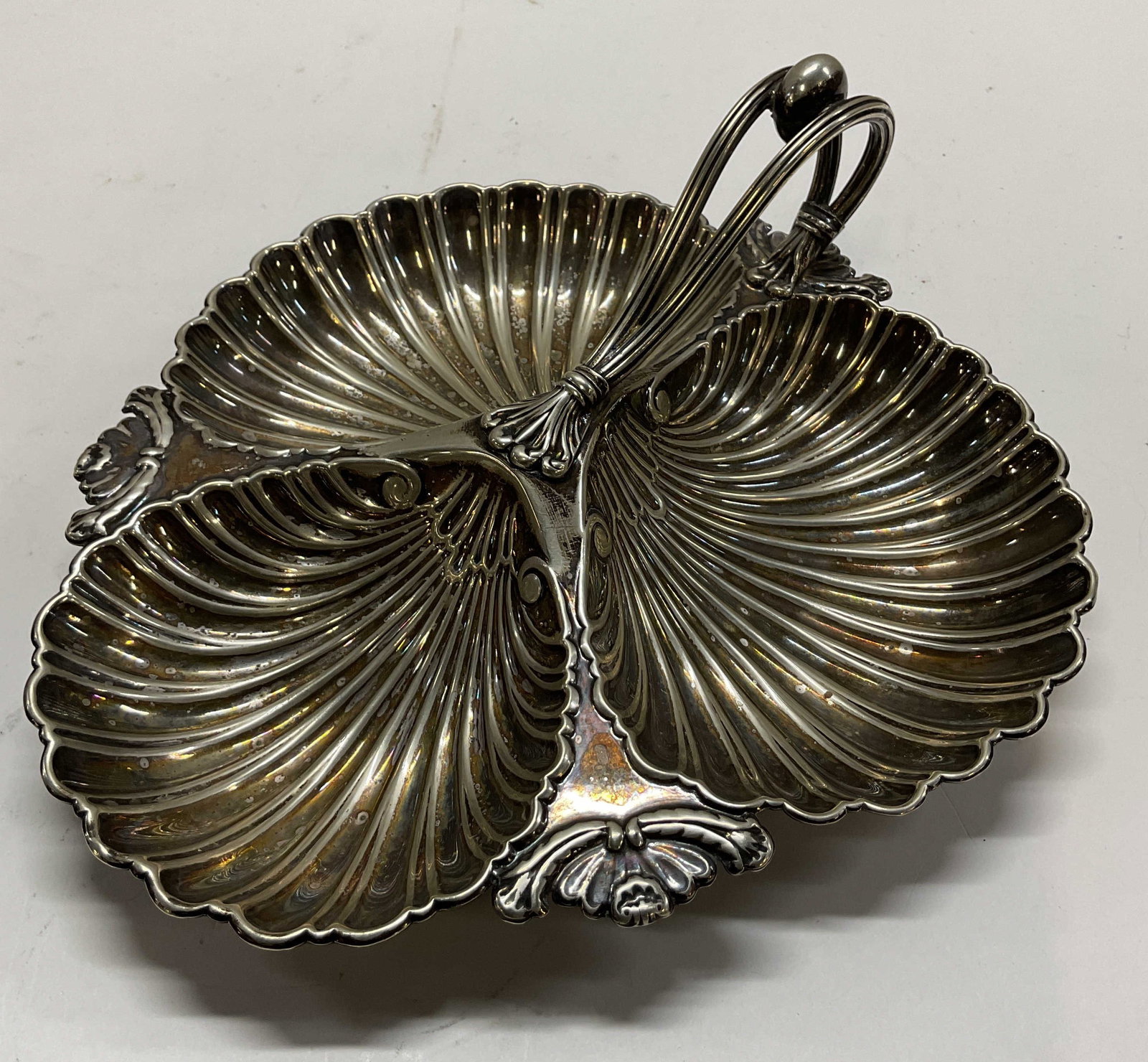 Walker & Hall SilverPltd Shell Serv Dish England: Walker & Hall silver plated shell divided serving dish. Marked on underside, reads Walker & Hall Sheffield England. Ornate curved handle with sphere design. Scalloped edge. Three divided sections, she