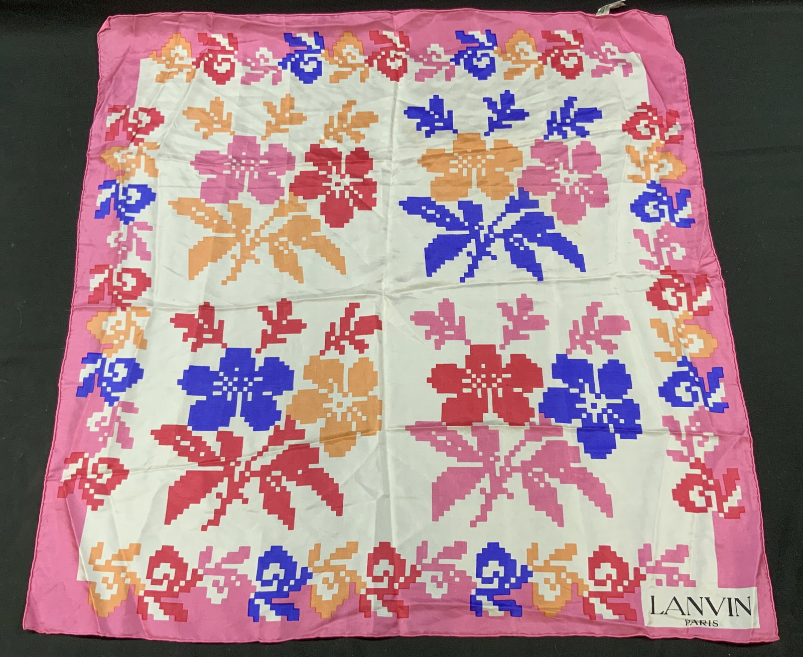 Vtg Lanvin Pixelated Floral Silk Scarf, France: Vintage Lanvin Paris Pixelated Floral Silk Scarf. Digital inspired pixelated geometric representations of blooming flowers and cherry blossoms. Vibrant pink blue and orange color palette. Bottom corne
