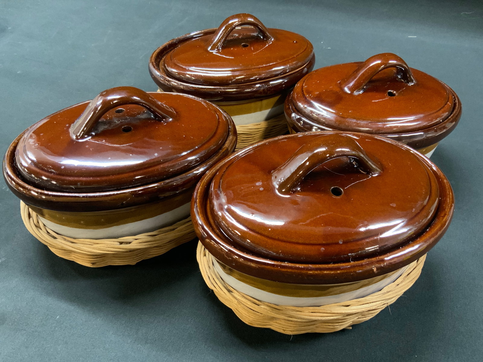 Vtg Lt4 Lidded French Onion Soup Crocks: Vintage tri color glazed soup crocks with lids and basket holders. Oven proof stoneware three toned glossy glaze with brown top, amber band and cream colored lower body. Includes 4 x matching crocks, 