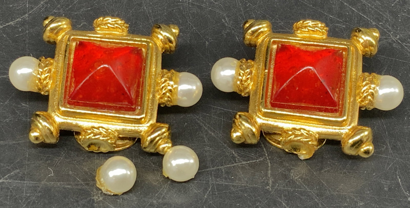 Sgnd Ben Amun Gold-Plated Clip-On Earrings: Signed Ben Amun Etruscan Revival Gold-Plated Clip-On Earrings. Tested with PuriTEST. Red pyramid-cut glass cabochon. Faux pearl accents on side. Missing stones. 2 included but need reattachment. Measu