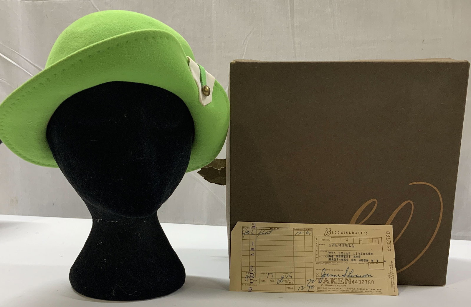 Vntg Mr. John lime green cloche hat 1960s: Vintage Mr. John lime green cloche hat. Made from 100% wool during the 1960s. The hat features an asymmetrical sculpted cloche silhouette. The striking green color was exceptionally popular during the