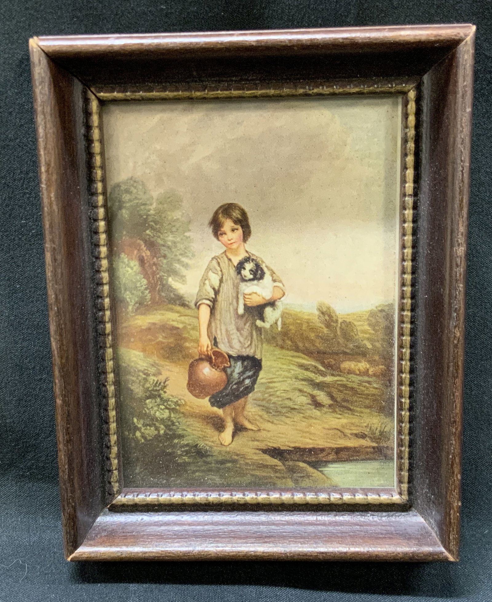 Vtg Gainsborough Cottage Girl Frmd Print: Vintage miniature art print of The Cottage Girl with Dog and Pitcher by Thomas Gainsborough. Printed Reproduction of original painting. Framed in deeply recessed dark wood frame with beaded inner bord