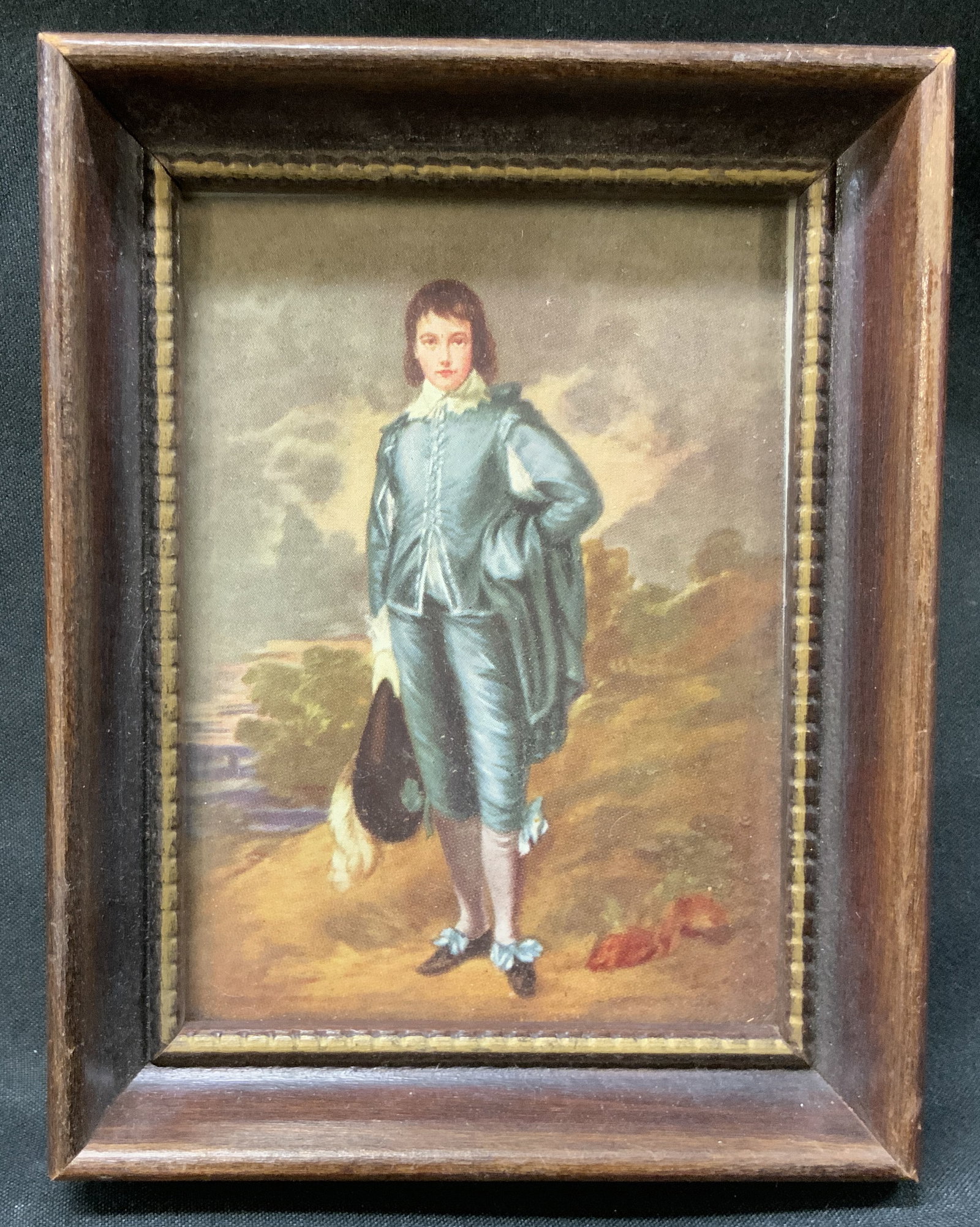 Vtg Gainsborough The Blue Boy Frmd Print: Vintage miniature art print of The Blue Boy by Thomas Gainsborough. Printed Reproduction of original painting. Framed in deeply recessed dark wood frame with beaded inner border. Condition consistent 