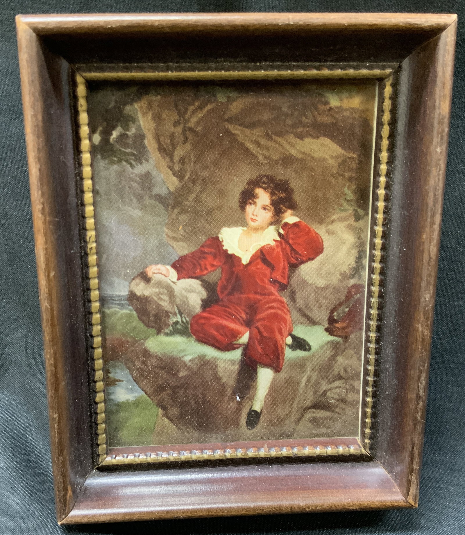 Vintage Lawrence The Red Boy Frmd Print: Vintage miniature art print of The Red Boy by Sir Thomas Lawrence . Printed Reproduction of original painting. Framed in deeply recessed dark wood frame with beaded inner border. Condition consistent 
