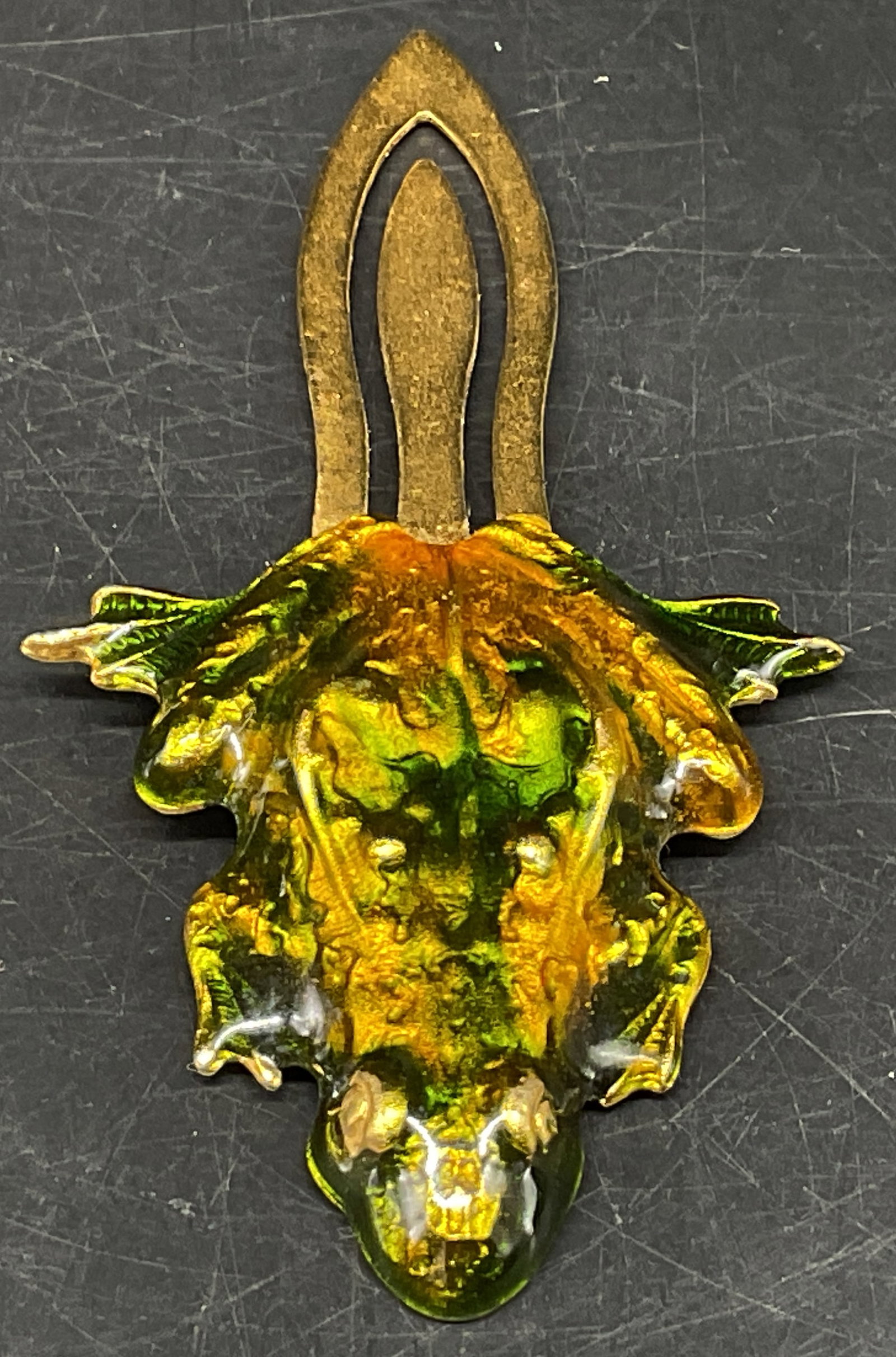 Vtg Enameled Metal Frog Bookmark: Vintage Frog Bookmark. Green and gilt enamel over gold-toned metal. Clip that fits over top of book page. Condition consistent with age and exposure. Measures app 3.25in H. vintage bookmarks, enamel,