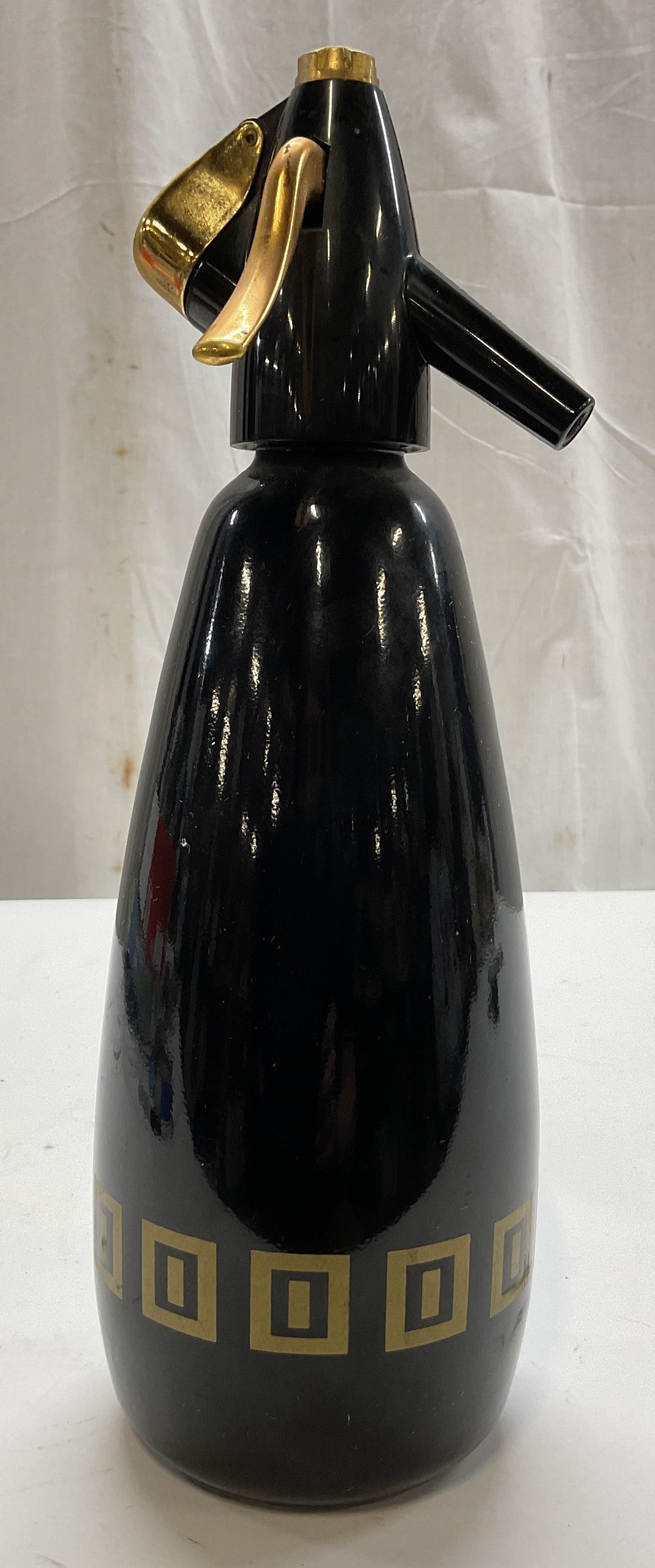 1970s Sparklets Executive Soda Syphon England: 1970s Sparklets Executive Hostmaster Mk3 glass soda syphon. Marked on underside, reads BOC Made In England. Glossy black bottle with gilt geometric pattern near base. Gold toned dispensing lever and t