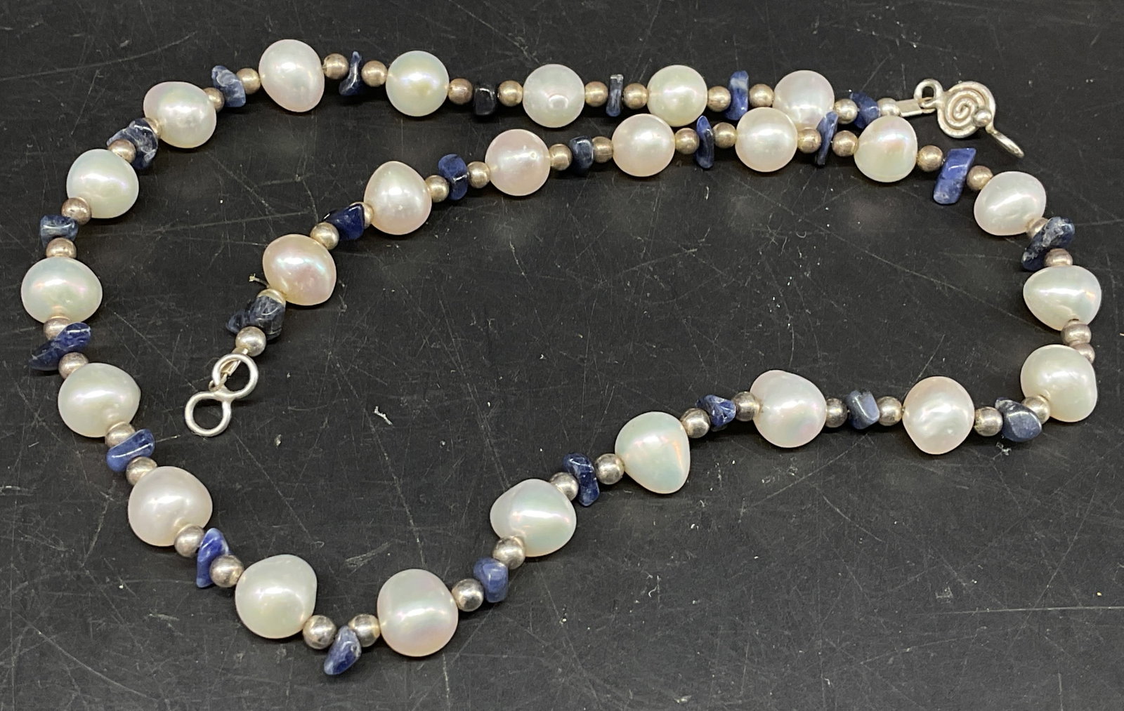 Freshwater Pearl & Blue Gemstone Necklace: Beaded Necklace. Made up of freshwater pearls and blue semi-precious gemstone chips, appears to be lapis lazuli. Tested with Presidium Gem Tester II. Corrosion present. Measures app 15in L.