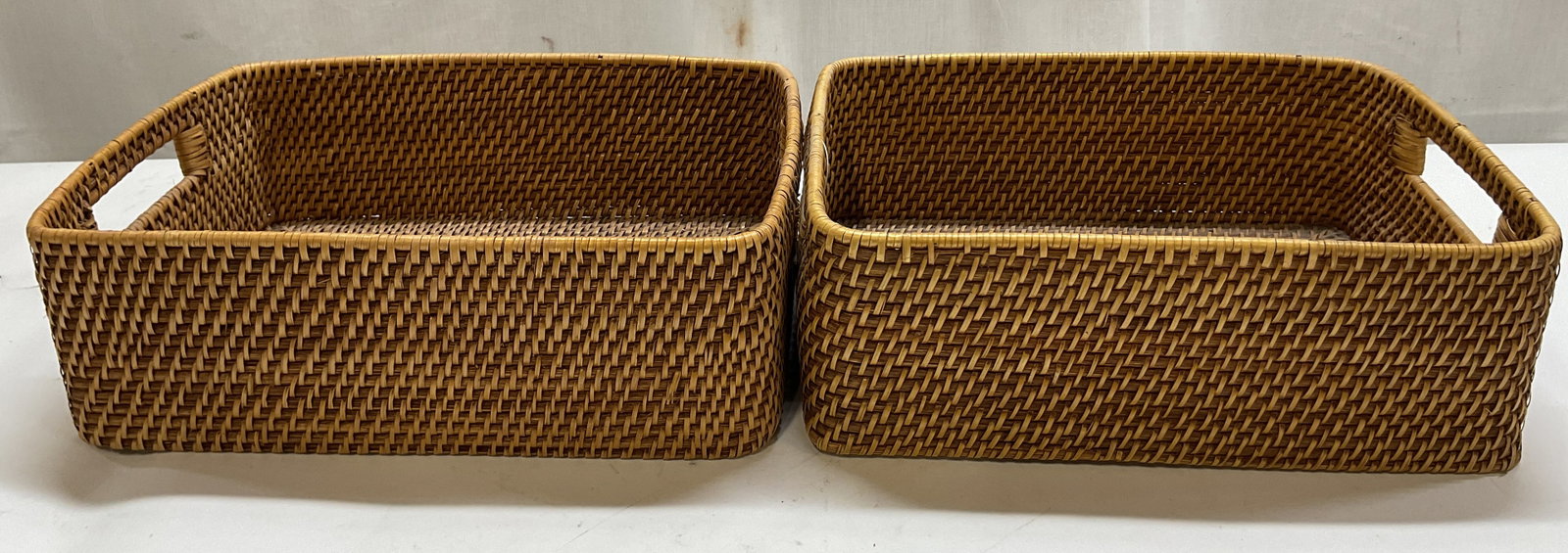 Pair Crate&Barrel Sedona Low Open Tote Philippines: Pair of Crate & Barrel woven rattan Sedona Low Open Totes. Made in Philippines. Original tag attached. Rectangular shape with open handles. Measures approx 10 x 13.5 x 4.5 inches. Surface wear