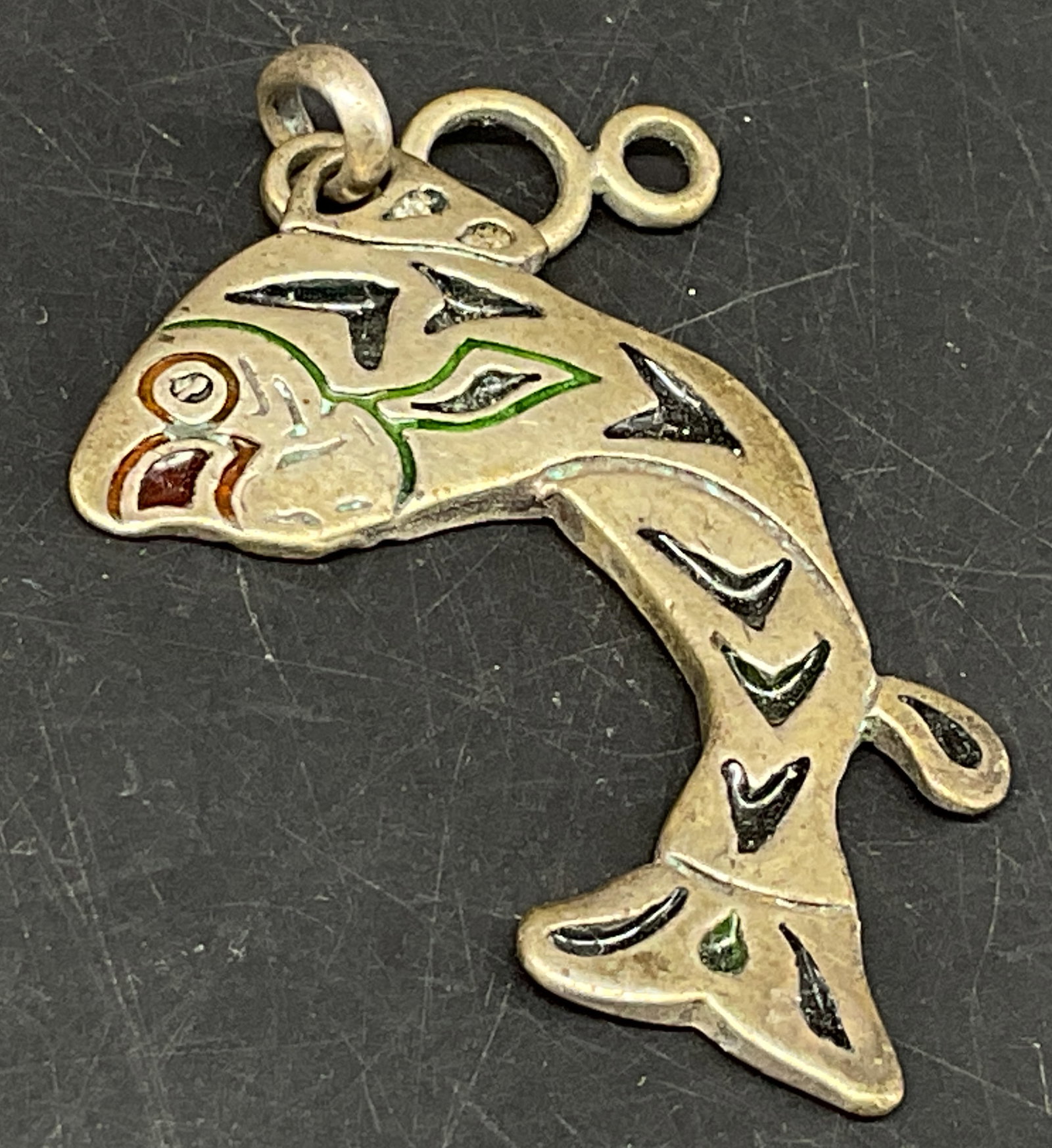 Vtg Indigenous-Style Enamel Salmon Pendant: Vintage Northwest Coast Indigenous-Style Champleve Enamel Silver-Toned Salmon Pendant. Formline art style. Tarnishing and color loss present. Measures app 2in H. vintage pendant, Northwest Coast,