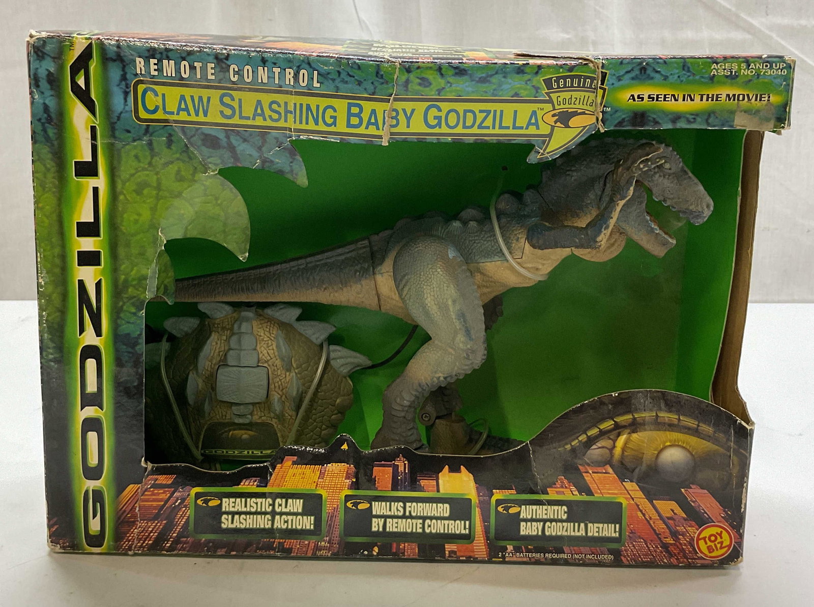 1998 Toy Biz Remote Control Baby Godzilla NIB: 1998 Toy Biz Remote Control Claw Slashing Baby Godzilla. New in box in original box, unopened. Godzilla figure with controller. Copyright 1998 Toy Biz. Box measures approx 4 x 11 x 8 inches. Some wear
