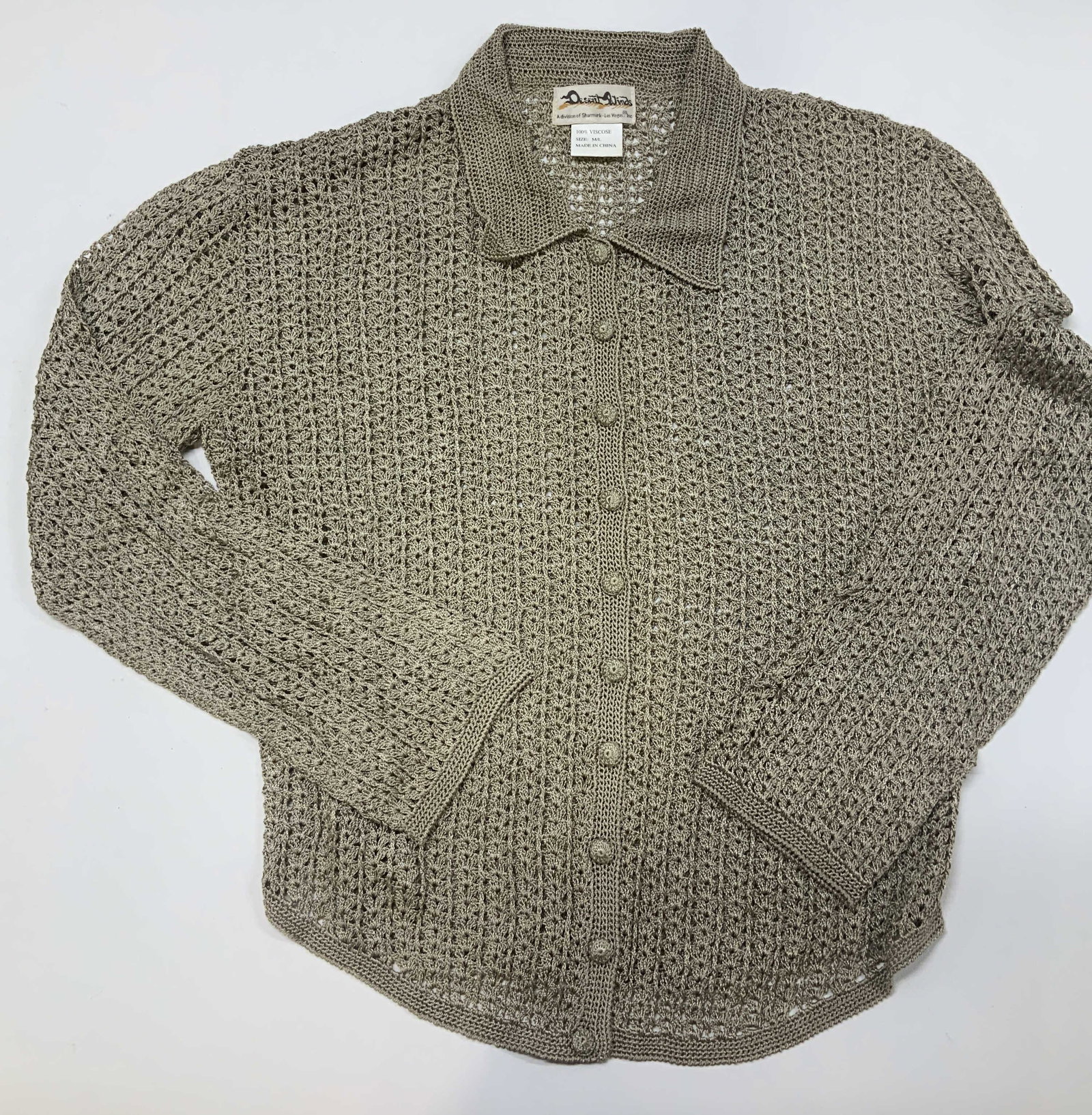 Vntg DESERT WINDS open knit button cardigan: Vintage DESERT WINDS open knit button cardigan. Made of 100% viscose in size M/L. It features a machine loomed open mesh stitch. It blanches a structured polo collar and function button placket with
