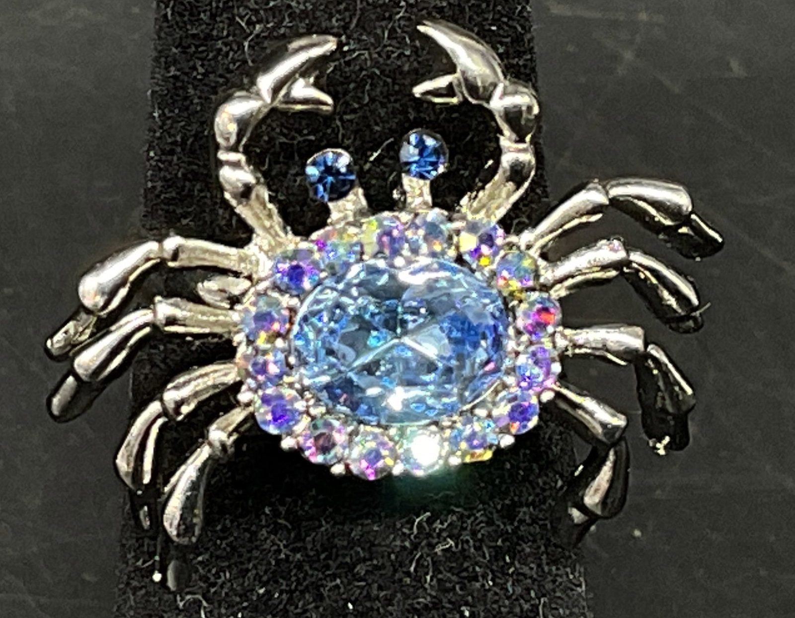 Silver-Toned Rhinestone Crab Ring: Silver-Toned Crab Ring. Blue and clear rhinestone accents. Condition consistent with age and exposure. Size 5.5. rings, silver-toned, rhinestones, crabs, ocean, coastal, jewelry 8 J