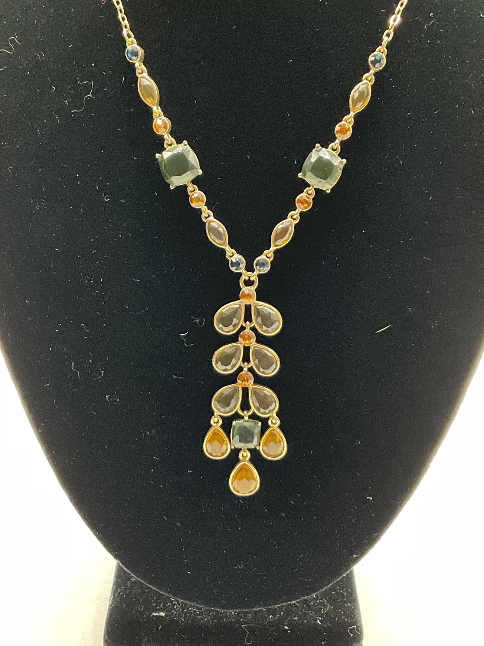Vintage Gold Toned Teardrop Necklace: Vintage gold toned teardrop necklace. Multicolored rhinestone details. Teardrop design. Measures approx 15 inches full length additional 2 inches, adjustable. Scratching and tangled chain. Jewelry, ne