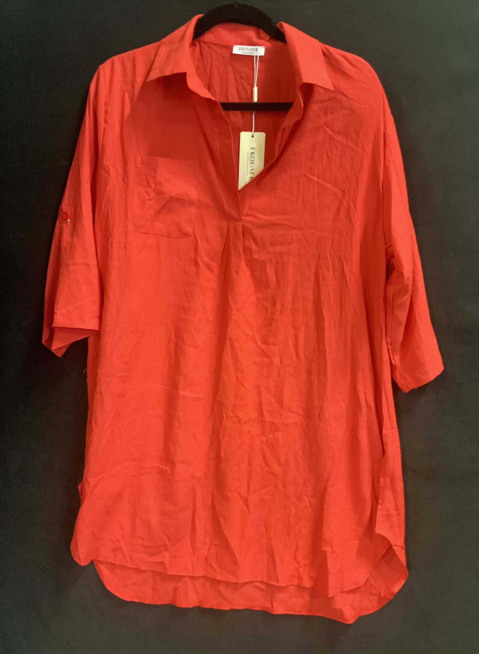 Vntg EKOUAER red shirt dress NWT: Vintage EKOUAER red shirt dress. New With Tags. Made from 100% rayon in size large. It features roll tab sleeves, the 3/4 sleeves have an inter fabric tab and exterior button allowing you to roll