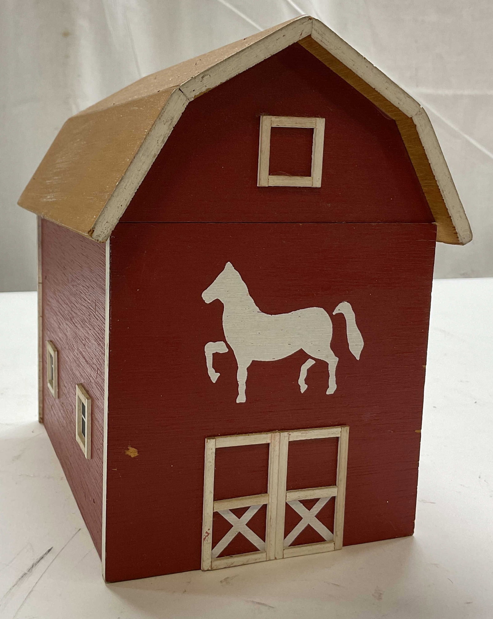1986 SGND Pine Creek Wooden Barn Music Box USA: Pine Creek wooden barn music box. Marked on underside, reads Pine Creek Collection Delavan Wisconsin. Signed, reads illegible, dated 1986. Barn shaped with removable lid. Hand painted red with white