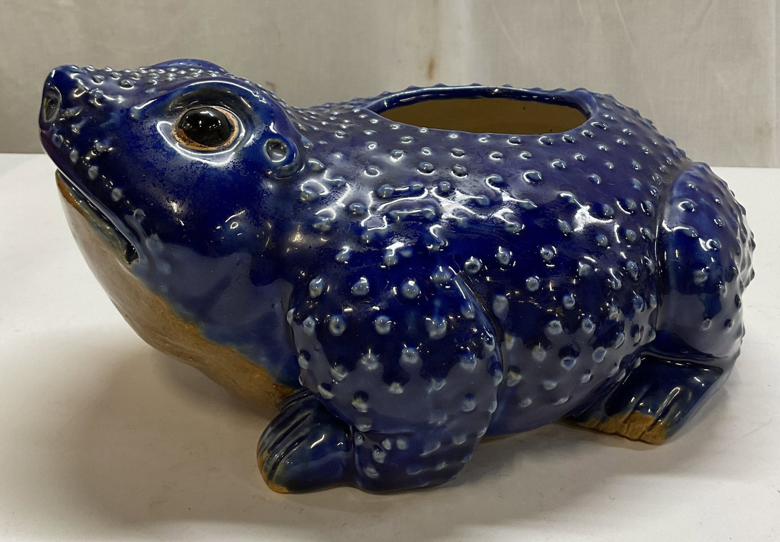 MMA Ceramic Cobalt Blue Hobnail Frog Planter: Metropolitan Museum of Art ceramic cobalt blue hobnail frog planter. Marked MMA on underside. Hobnail texture. Cobalt blue glazed, glossy finish. Detailed features and textures. Measures approx 9 x