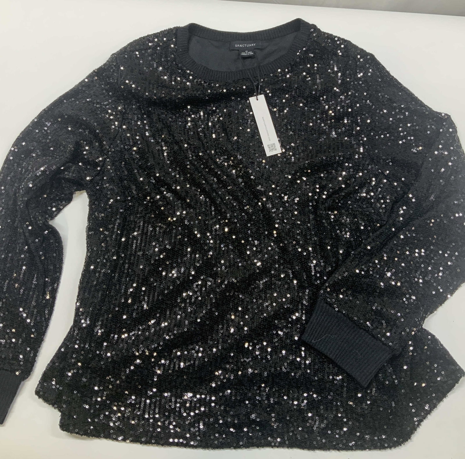 SANCTUARY black sequin sweatshirt, NWT: SANCTUARY black sequin sweatshirt. New With Tags. Made of polyester spandex blend in size 1X. Designed with an all over sequin mesh base that catches the light. Features a relaxed fit with a classic