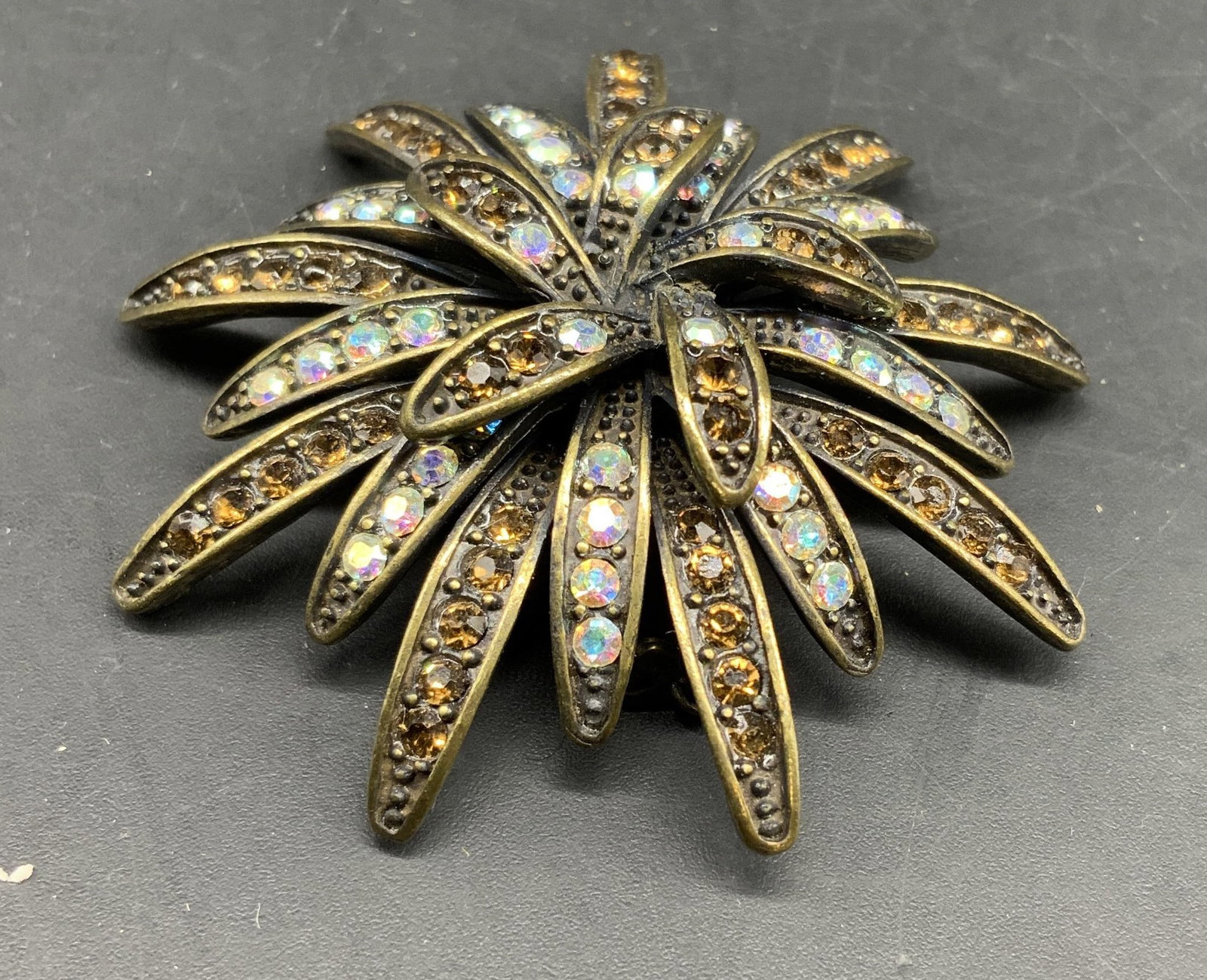 Sgnd PD Notting Hill Bronze Starburst Brooch: Vintage costume jewelry brooch is Notting Hill Bronze Starburst created by and signed by Premier Designs on oval cartouche, with a stylized crown makers mark, , mid century piece with starburst design