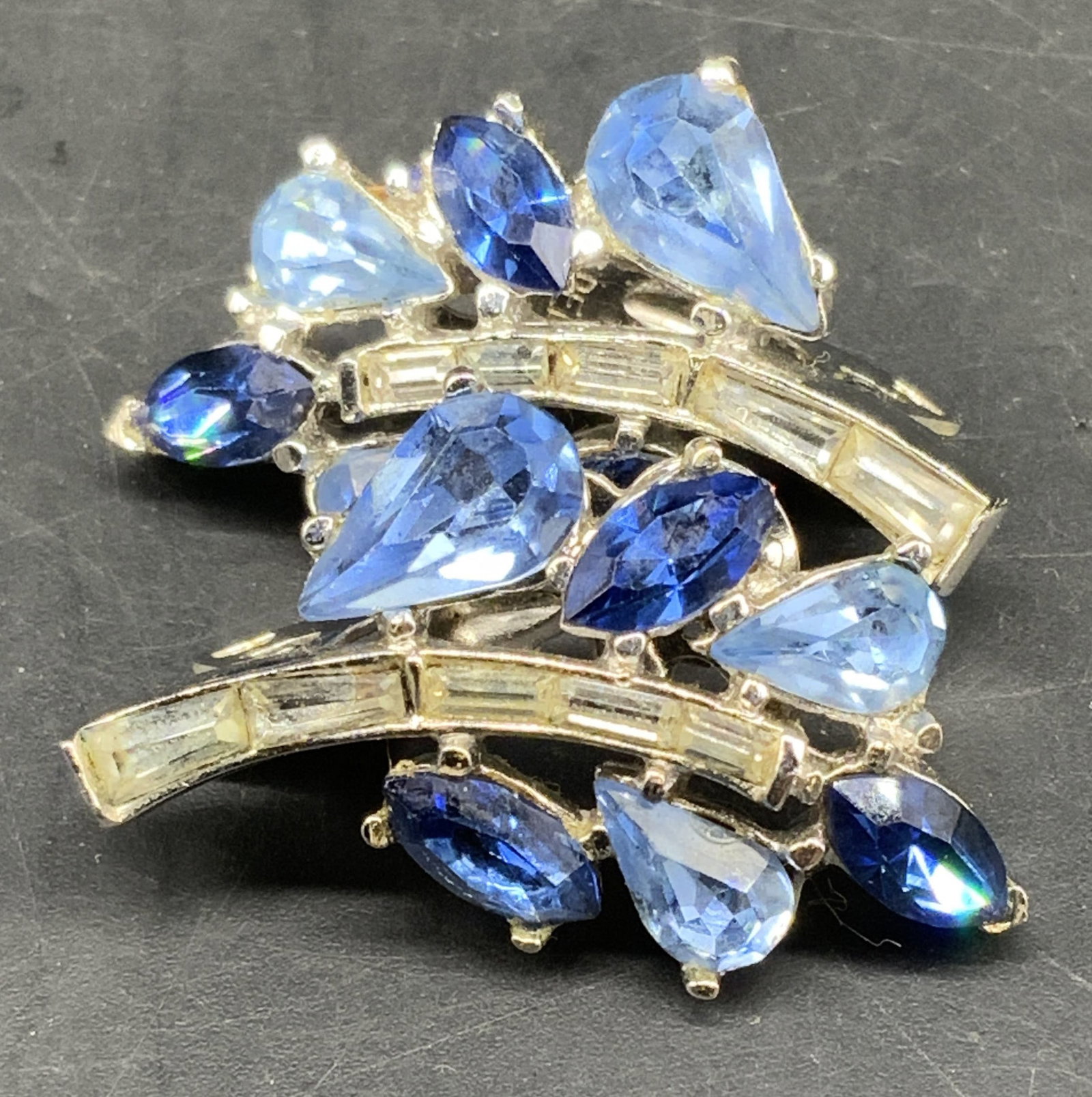 Vintage signed Trifari Blue Rhinestone Earrings: Vintage mid century pair of silver toned Trifari earrings featuring light blue and dark blue rhinestones, designed by Alfred Phillips c 1950s, each measures 1.25 inches, vintage jewelry, estate