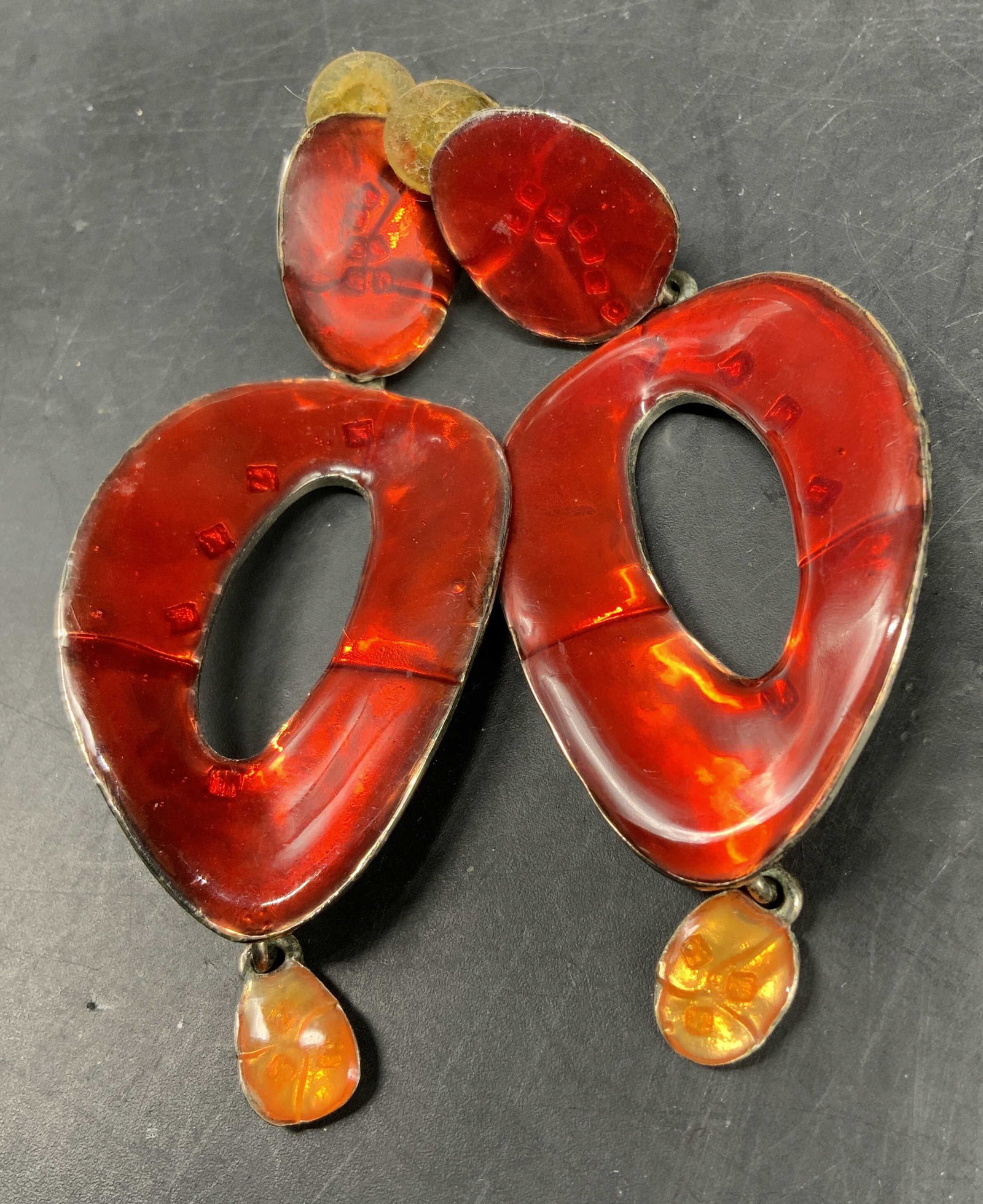 Cecile & Jeanne French Red Slvr Statement Earrings: Signed verso Cecile and Jean, French Costume Jewelry Brand, features makers signature stamp on verso, large oval dangle drop earrings featuring bright red enamel on silver, design features a bold asym