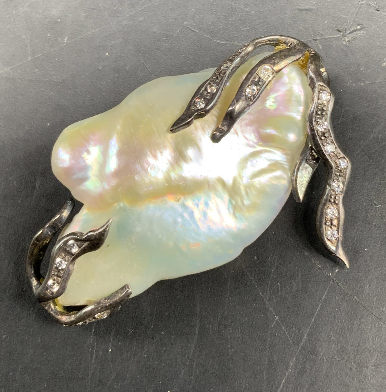 Sterling & lg baroque Fresh Water Pearl Pendant: Large Organically shaped Fresh Water Baroque Pearl with Sterling Silver branch forms set with pave diamonds, brutalist style, artisan handcrafted piece, measures app 1.5 by 1.5 inches -j