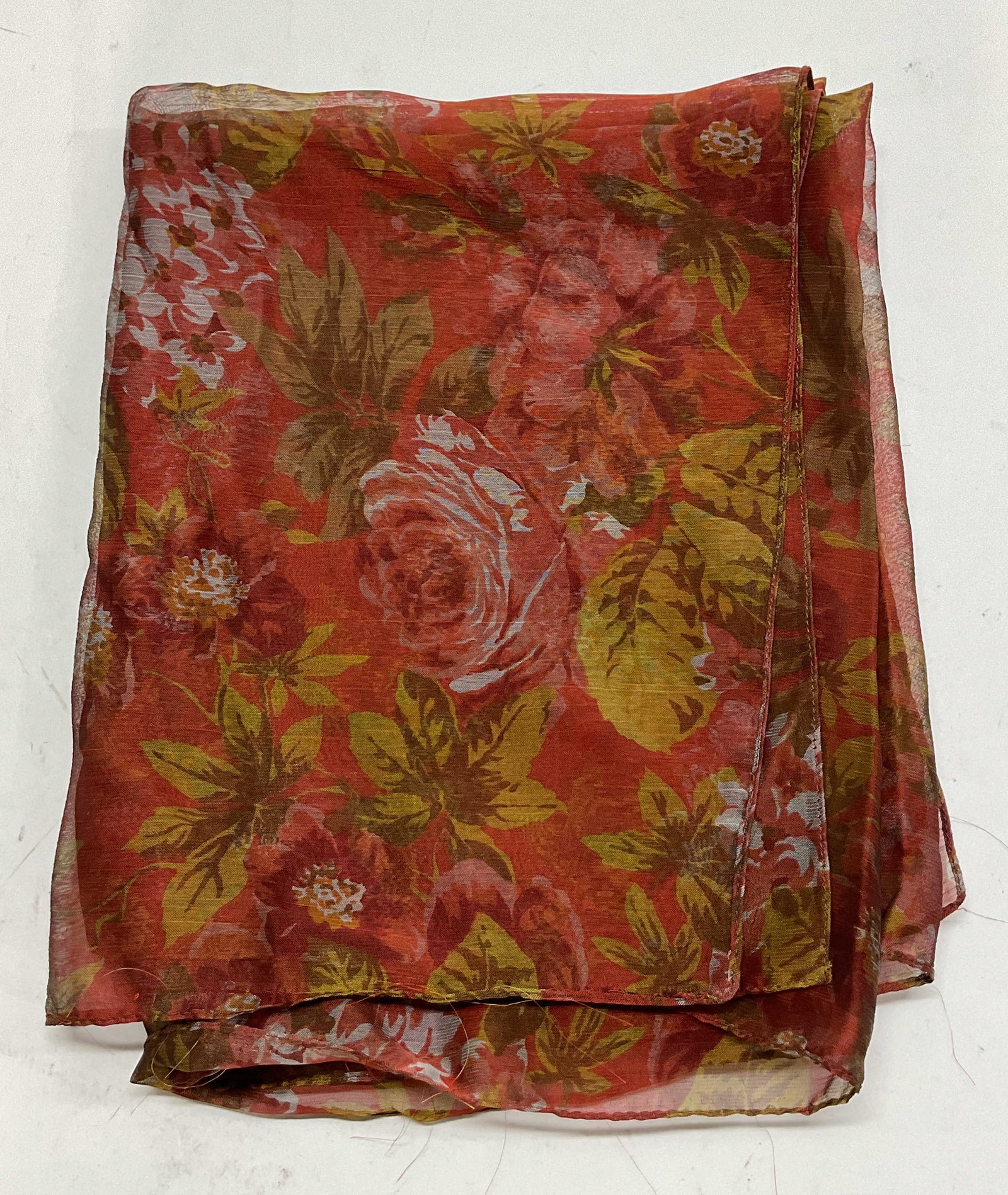 Vintage Red Sheer Floral Scarf: Vintage red sheer floral scarf. Floral motifs in varying colors, main red background. Measures approx 21 x 70 inches. Pulling to trim. Scarf, wearables, clothing, outerwear, fashion, accessories. 4SB