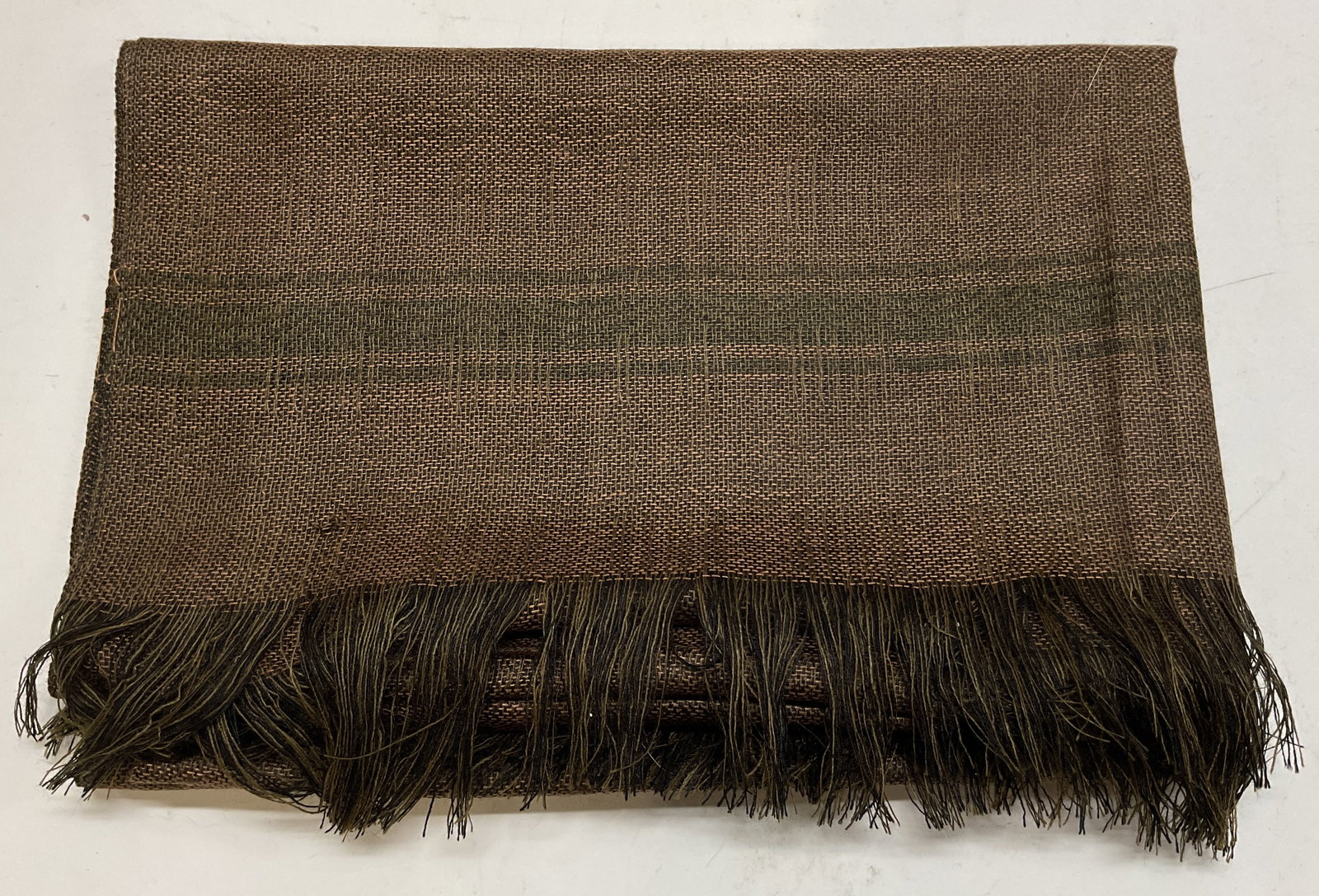 Hand Made Woven Cotton Fringed Scarf Ecuador: Hand made woven cotton fringed scarf. Tag reads Artesainas Tahuantinsuyo hand made in Ecuador 100% cotton. Fringed trim. Green and brown geometric pattern. Measures approx 23 x 66 inches. Wear consist